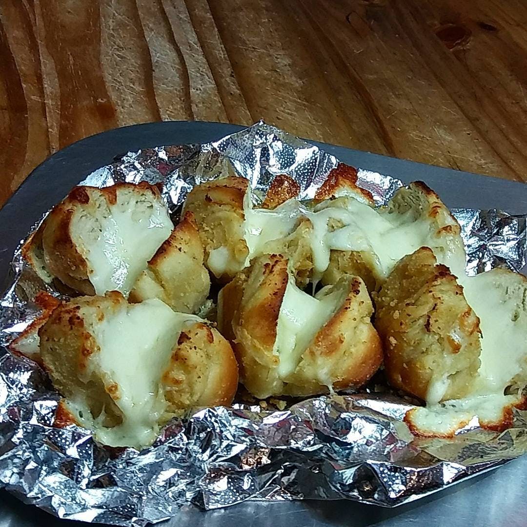 Order Garlic Knots with Cheese - 4 Pieces food online from Koronet Pizza store, New York on bringmethat.com