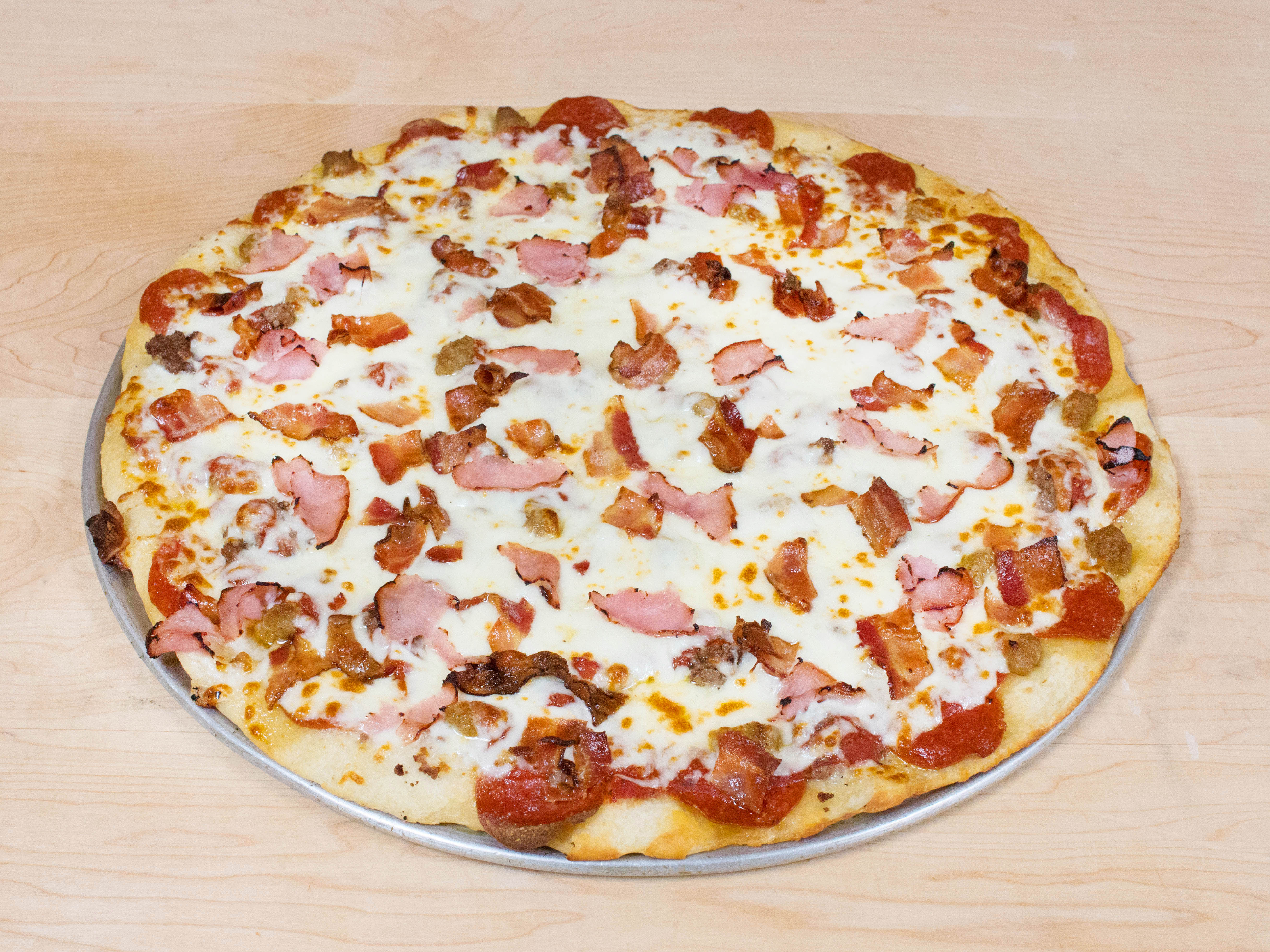 Order Mancino's Man Eater Pizza food online from Mancinos - S. Cedar store, Lansing on bringmethat.com