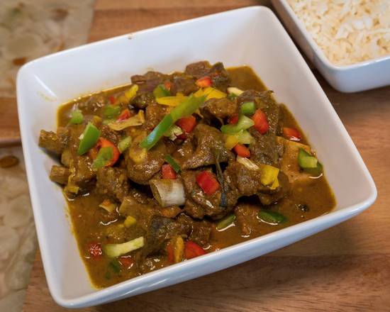 Order Curry Goat food online from 876 Nyamminz Jamaican Cuisine store, Marietta on bringmethat.com