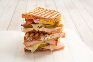 Order Turkey Ham Cuban Panini food online from Green Leaf's and Bananas store, Concord on bringmethat.com