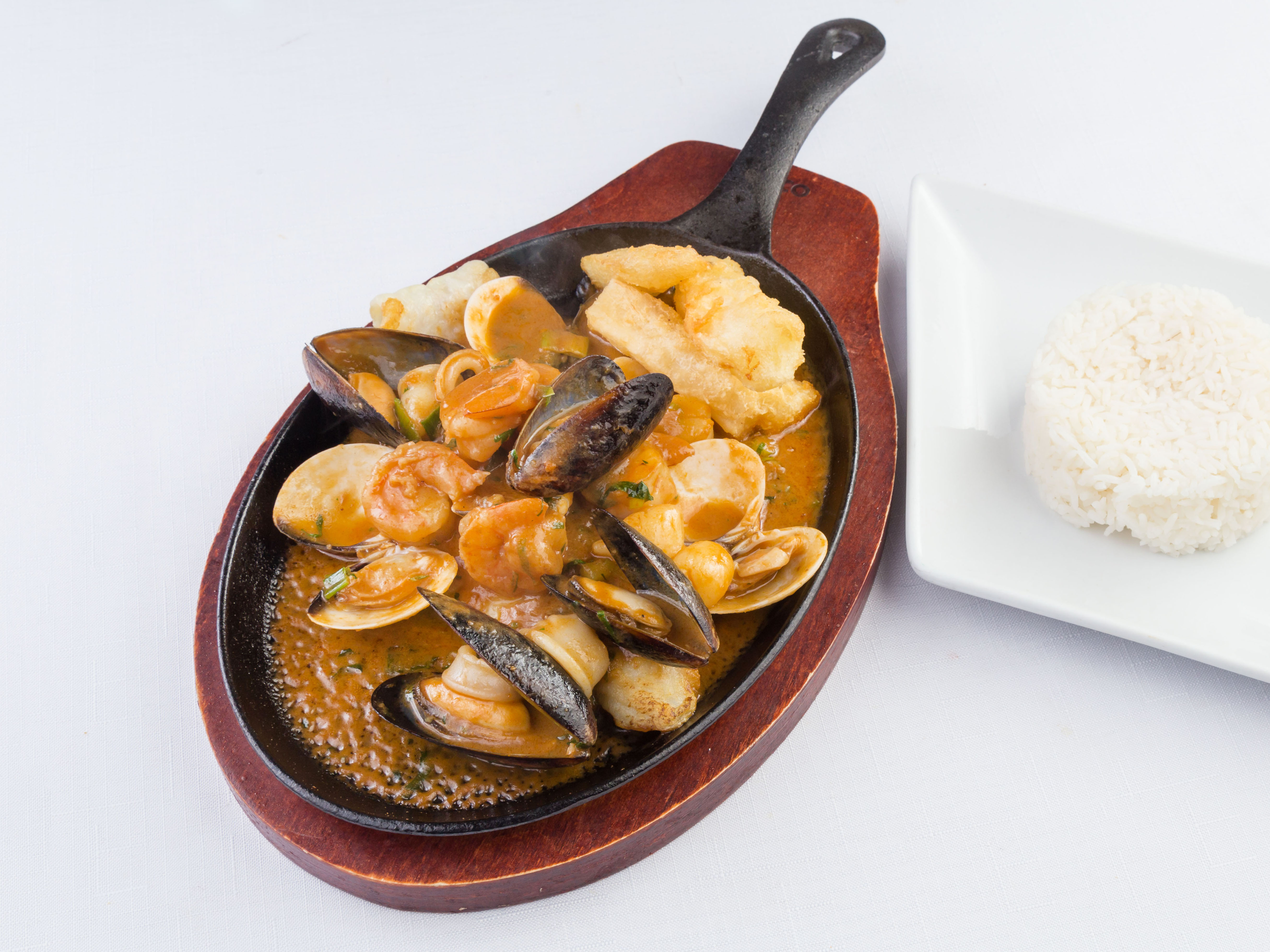 Order Pescado a lo Macho food online from Sur Latin Peruvian Cuisine store, Houston on bringmethat.com