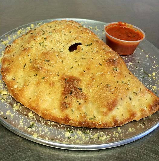 Order Traditional Calzone food online from Randy's Pizza store, Raleigh on bringmethat.com