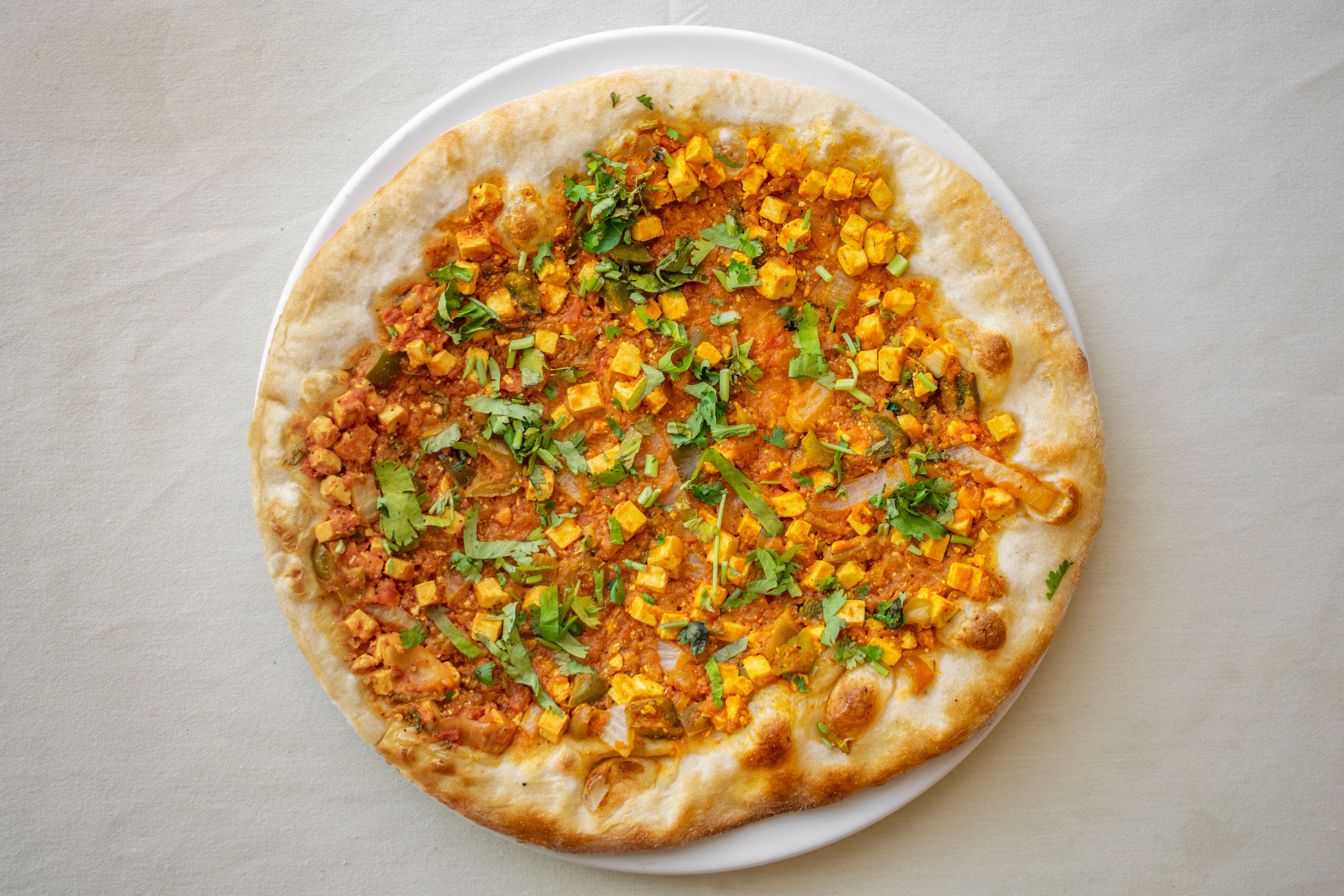 Order Chili Panner Masala Pizza - Large food online from Vinnie's Pizzeria Ristorante store, Boonton on bringmethat.com