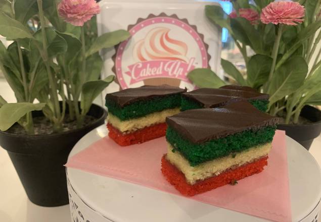 Order Rainbow cookies food online from Caked Up Cafe store, New City on bringmethat.com