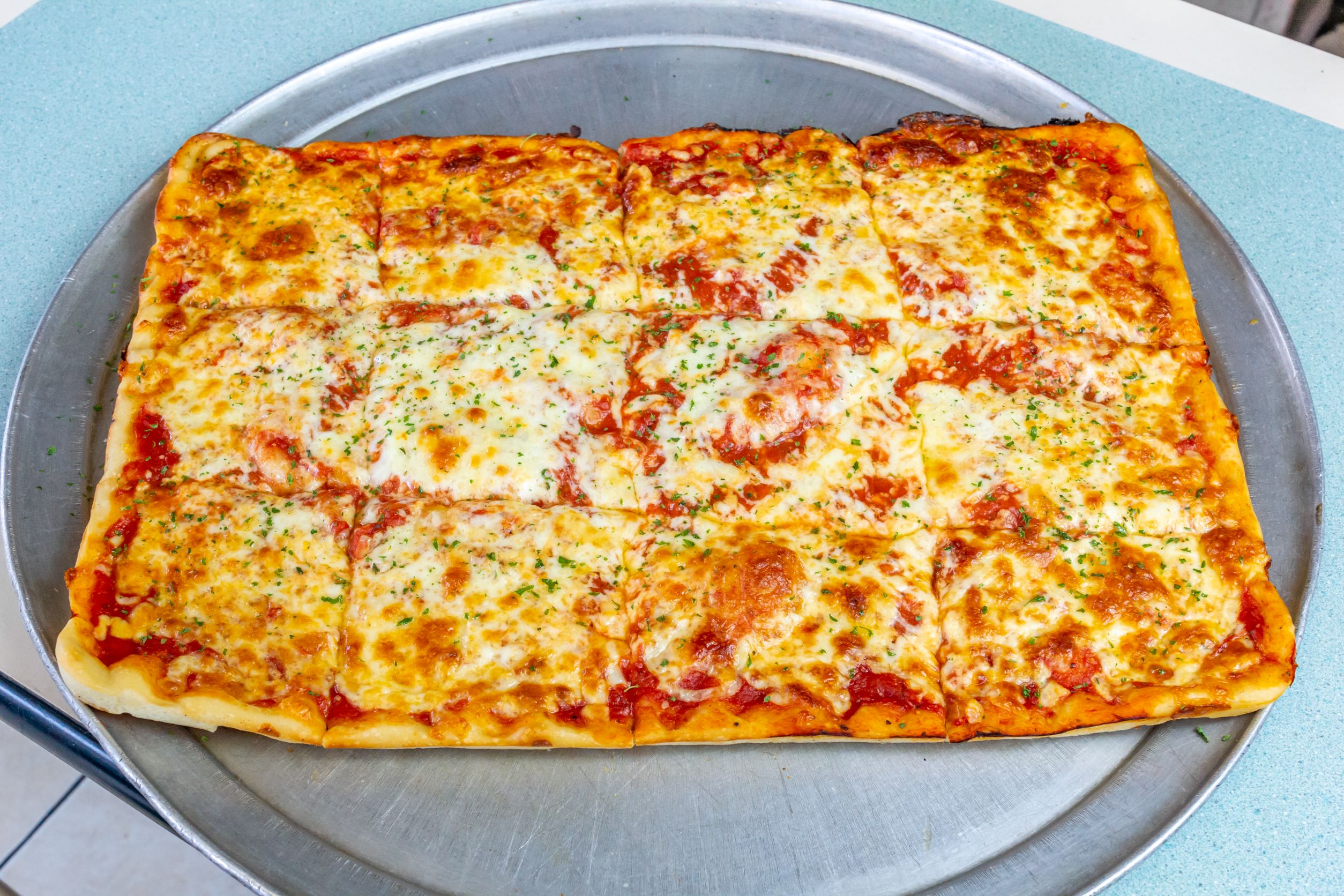 Order 12 Cut Cheese Pizza food online from Elias Pizzeria store, East Greenbush on bringmethat.com
