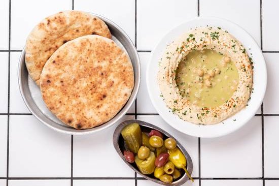 Order Hummus food online from 12 chairs store, New York on bringmethat.com