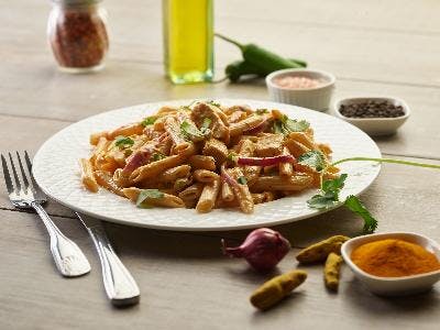 Order Butter Chicken Pasta Twist - Pasta food online from Chicago's Pizza With a Twist store, Clovis on bringmethat.com
