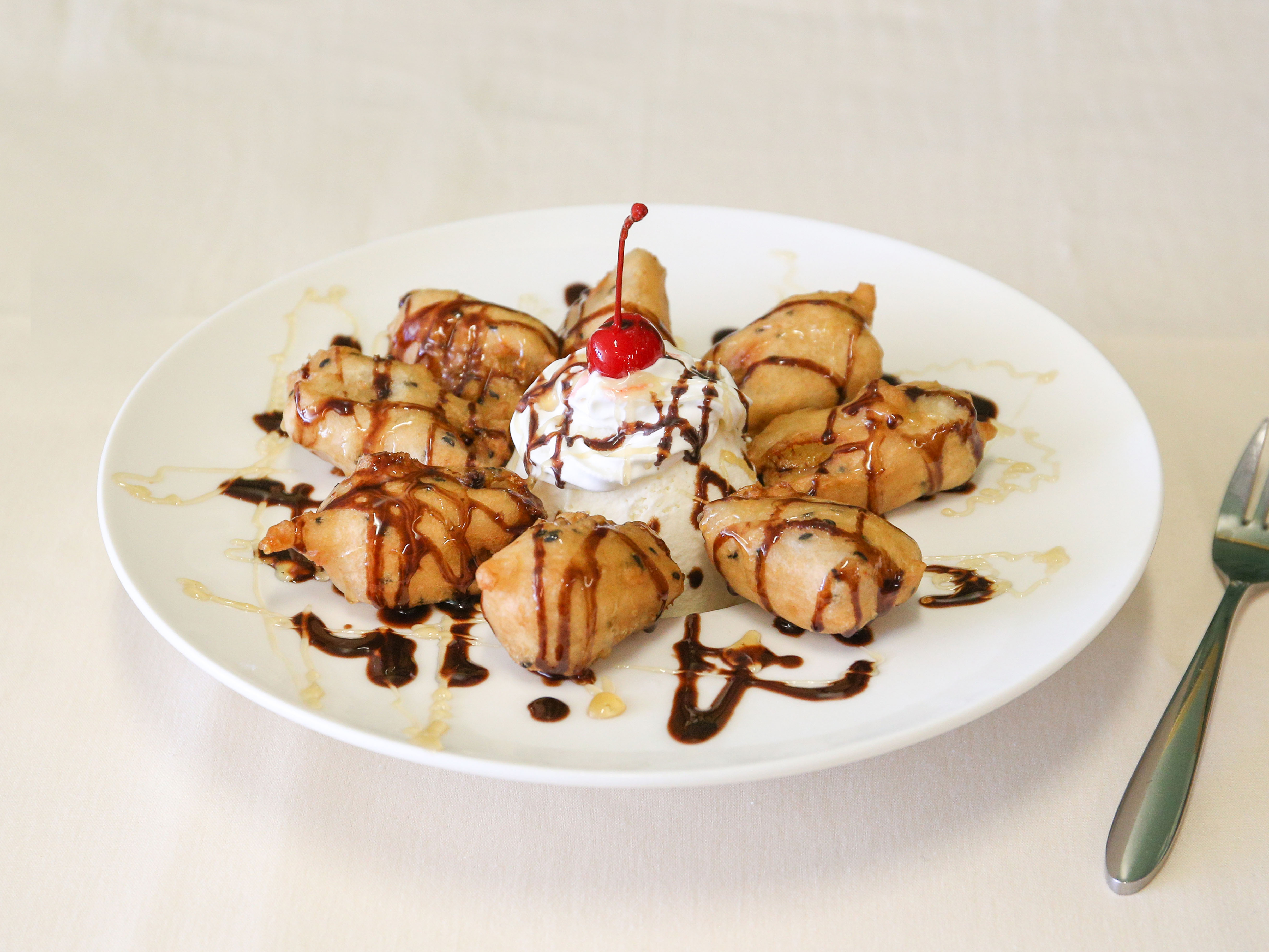 Order 69. Fried Banana with Ice Cream food online from Thonglor Thai Bistro store, San Mateo on bringmethat.com