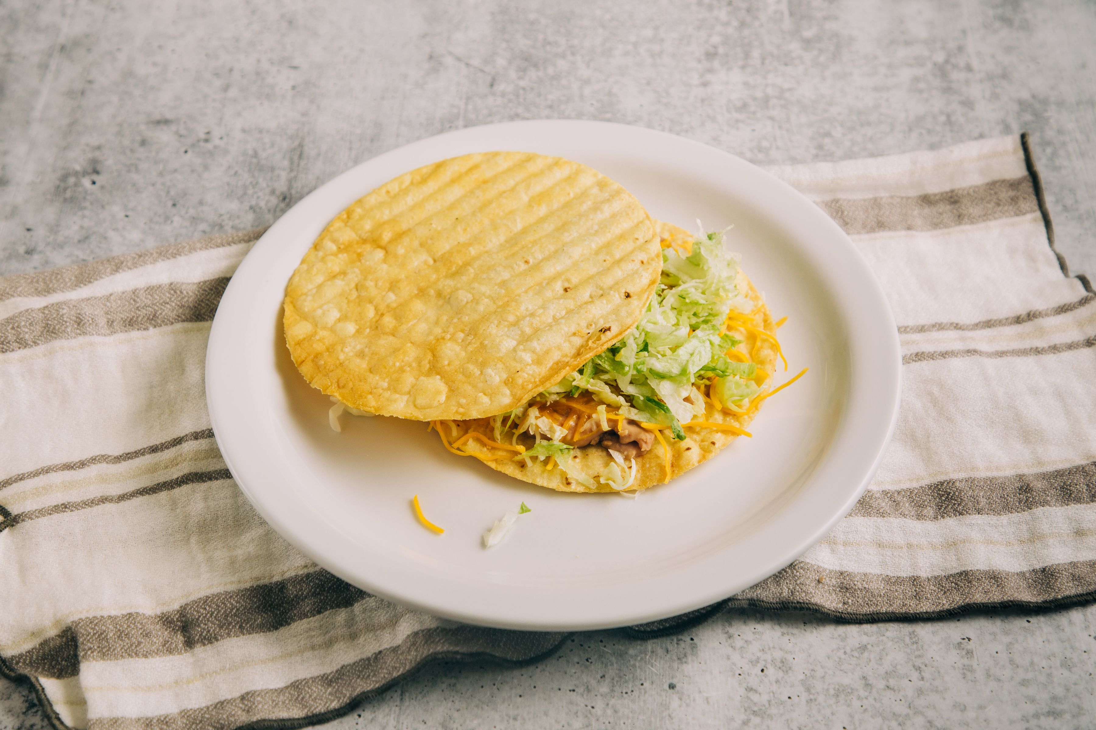 Order Chicken Tostada food online from Betos Mexican Food store, West Valley City on bringmethat.com