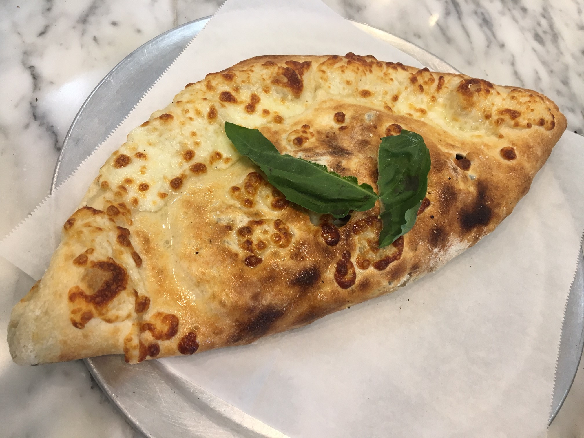 Order Tre Formaggi Calzone food online from Tonino's Place Pizzeria store, Woodland Hills on bringmethat.com