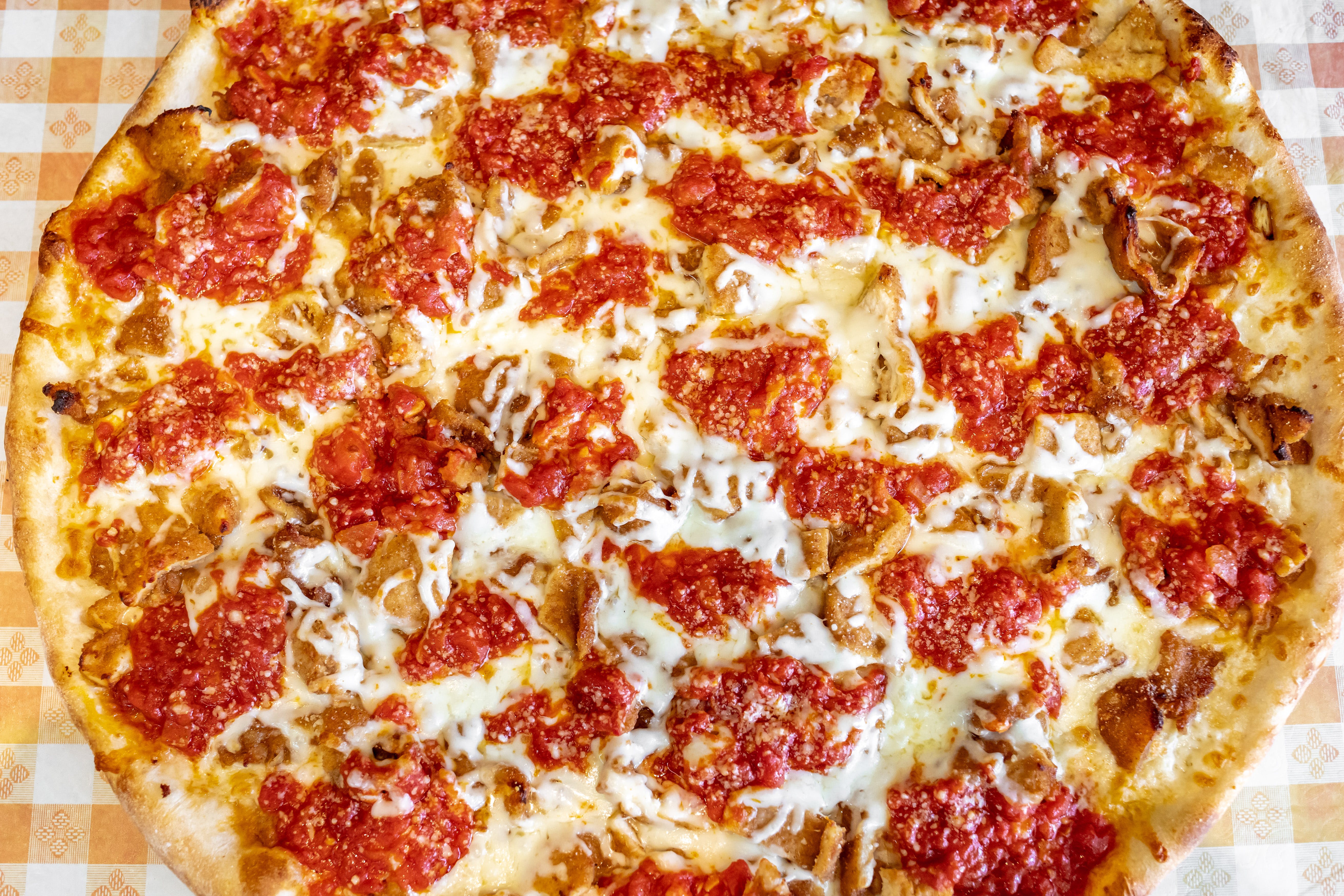 Order Chicken Parmigiana Pizza - 12" food online from Carmine's Pizzeria store, Brooklyn on bringmethat.com