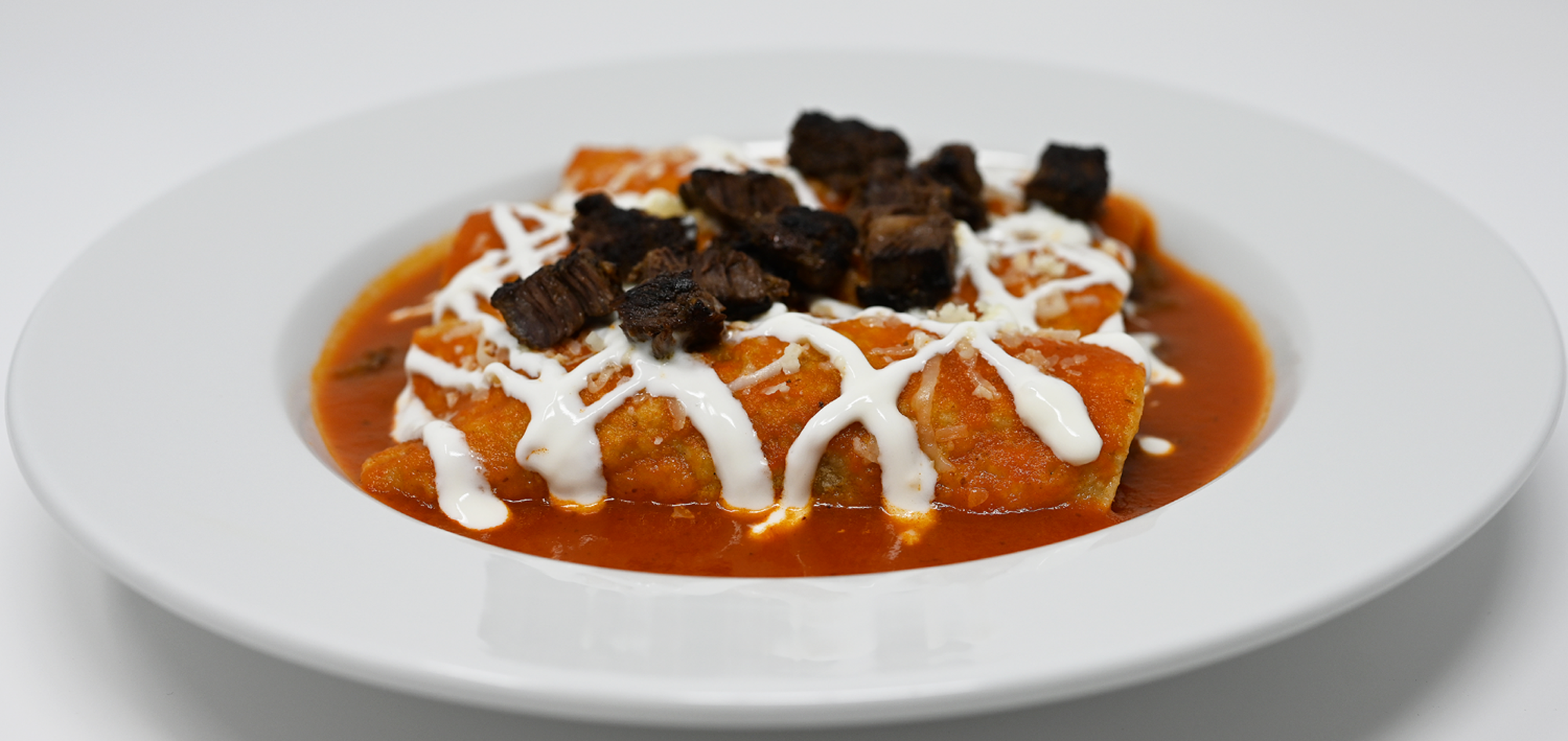 Order Carne Asada Enchiladas food online from Mixteco Mexican Grill store, Chicago on bringmethat.com