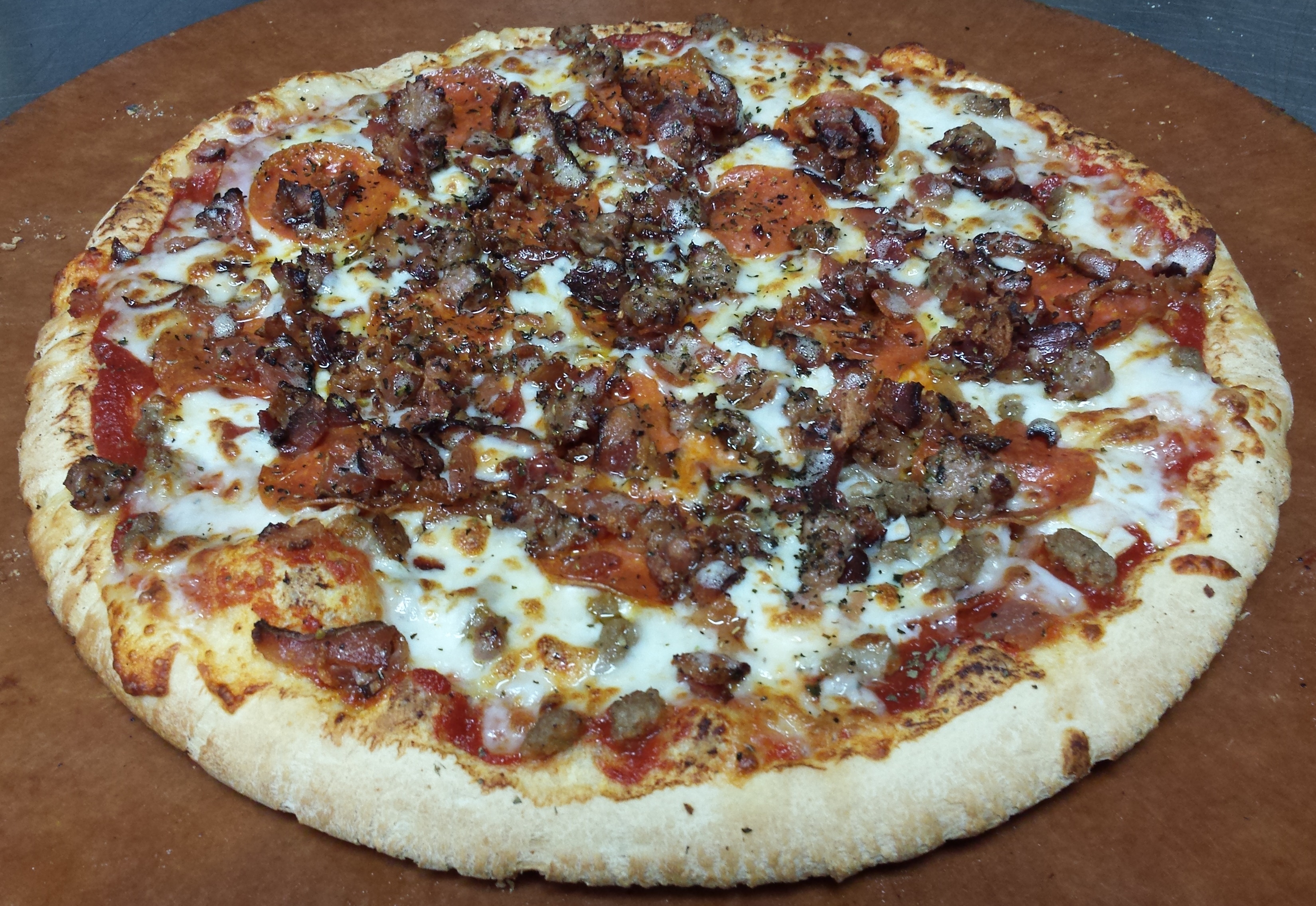 Order Hand-Tossed All Meat Pizza food online from Firehouse Pizza store, East Peoria on bringmethat.com