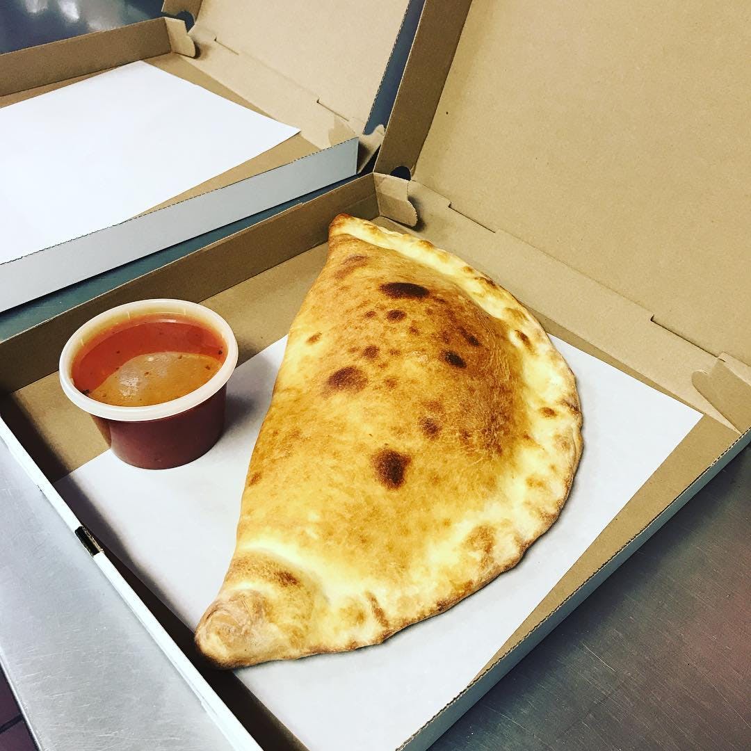 Order Ricotta Cheese Calzone - Individual food online from Garrison Pizza Cafe Inc store, Garrison on bringmethat.com