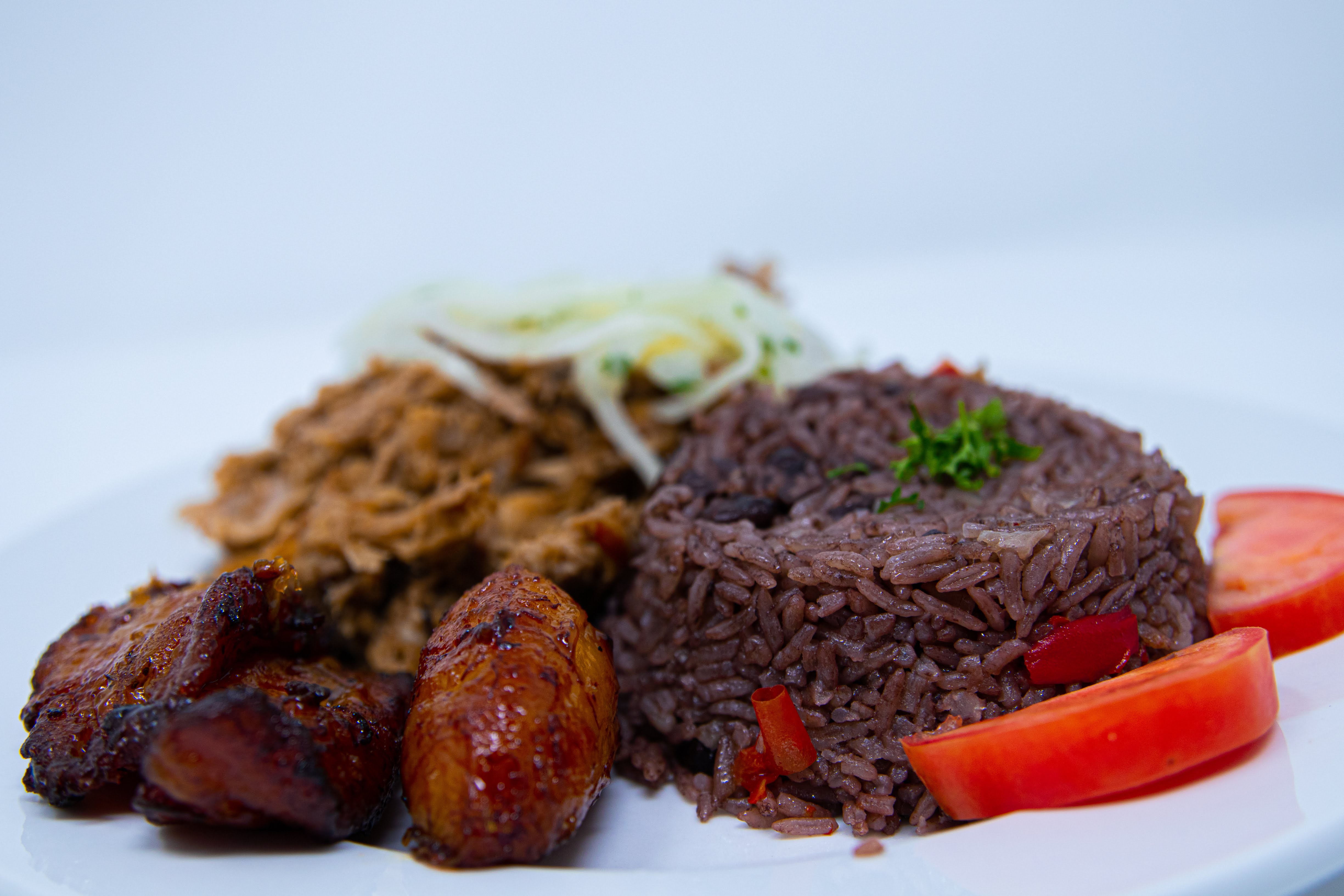 Order Puerco Asado food online from Cafe Con Leche store, Seattle on bringmethat.com