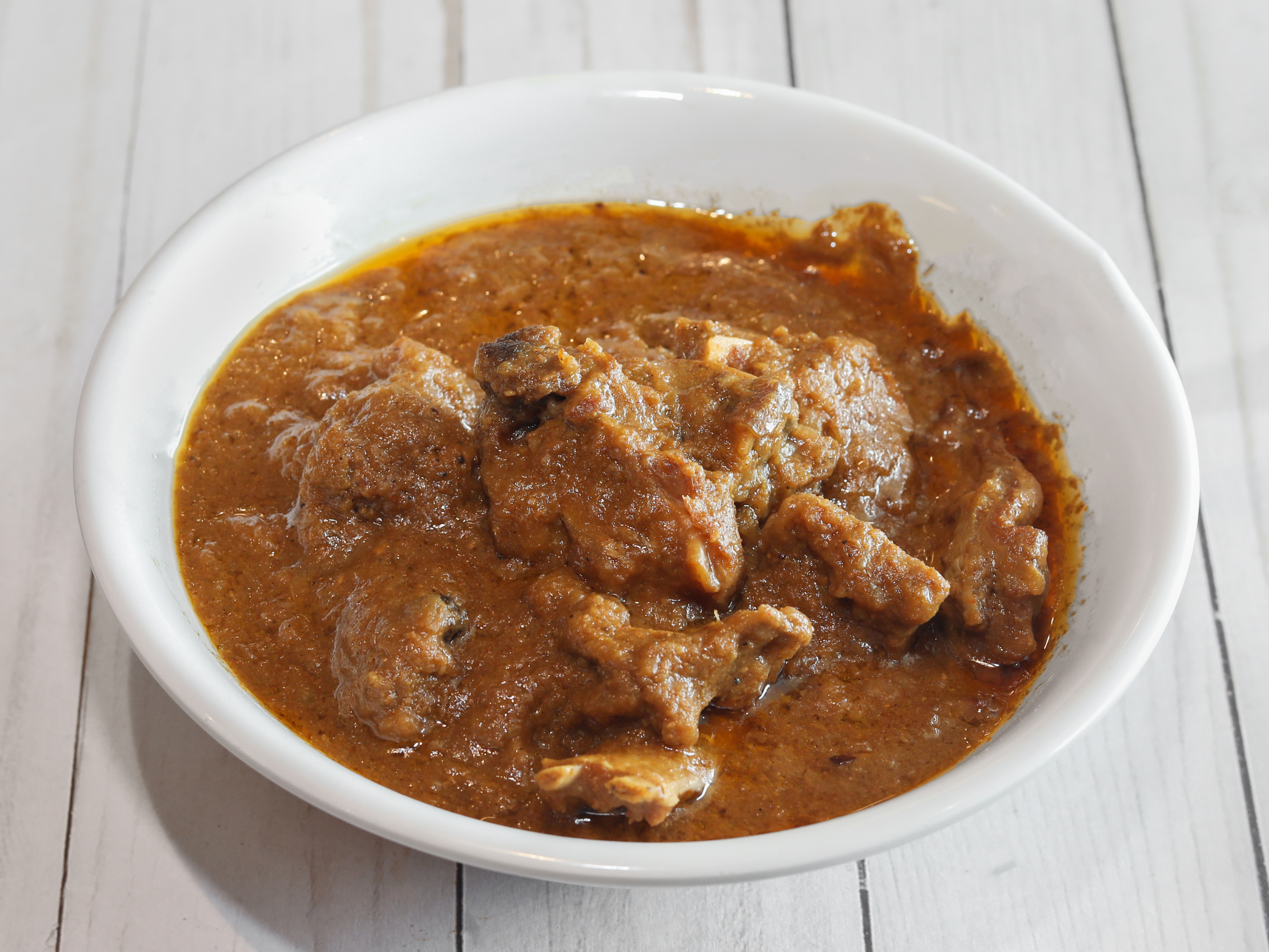 Order Mutton Qorma food online from The Mughals store, Norcross on bringmethat.com