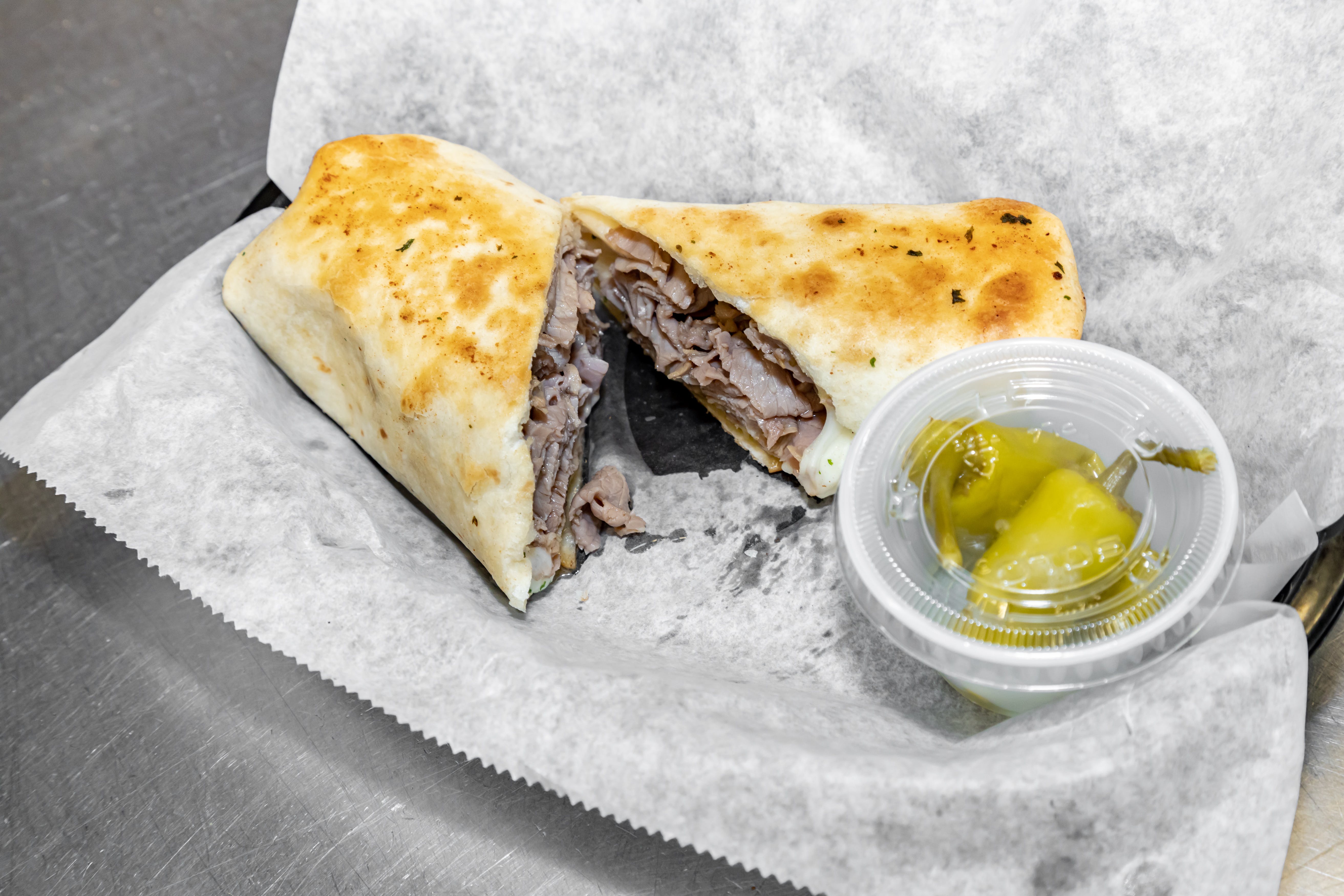 Order Garlic Beef Wrap - Wrap food online from Luconi's Pizza store, Bradley on bringmethat.com