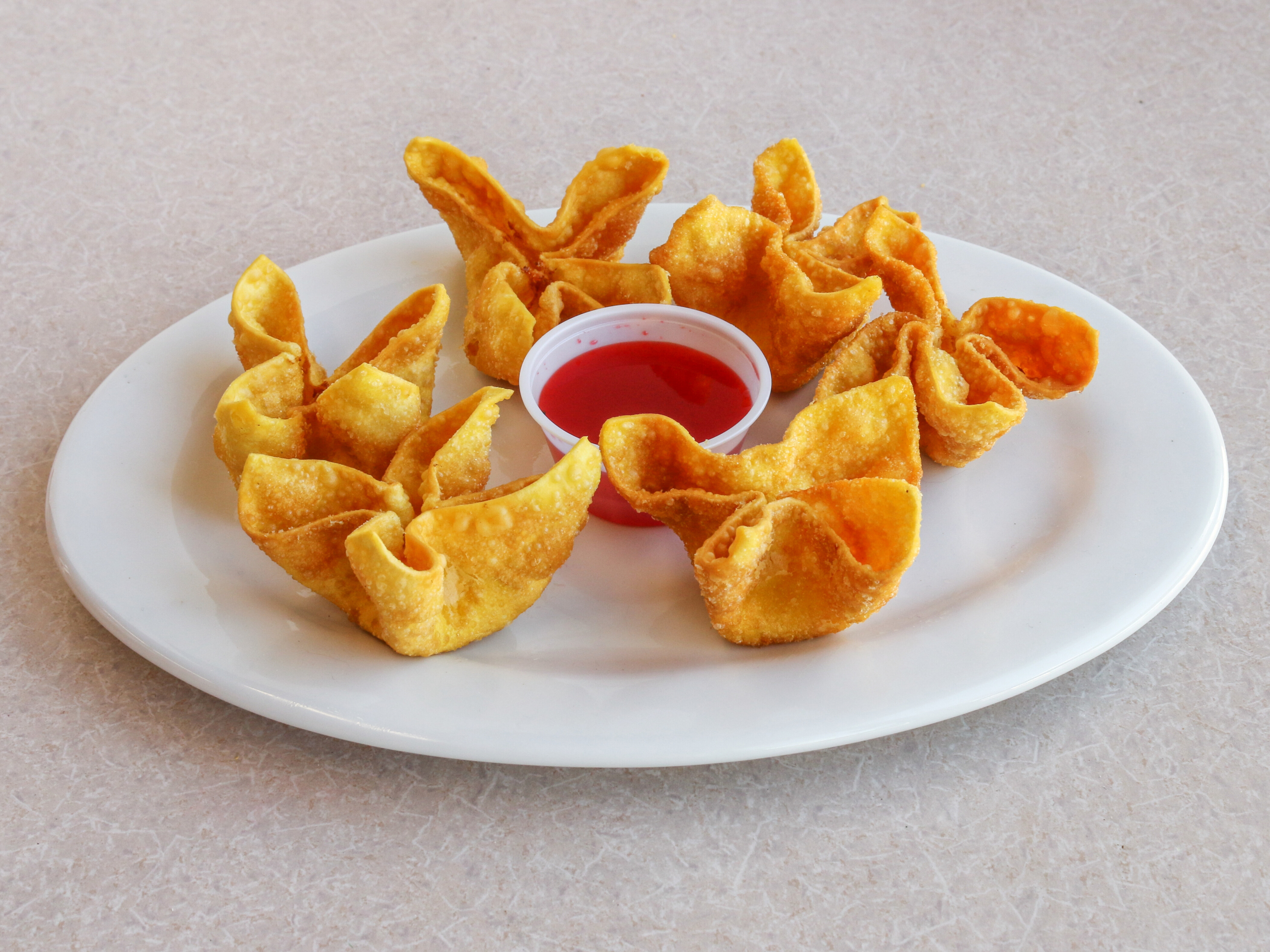 Order 6 Piece Cream Cheese Wonton food online from Bamboo Cafe store, Bakersfield on bringmethat.com