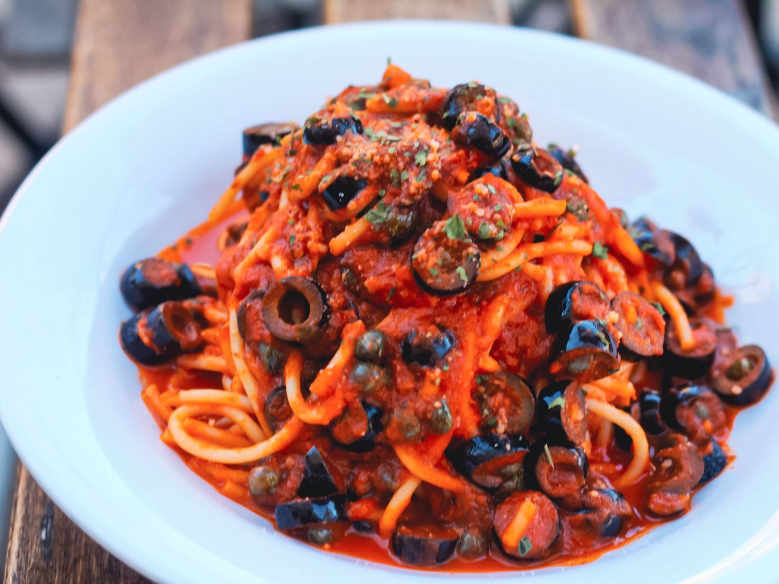 Order Spaghetti Puttanesca food online from Alessio’s Cafe | Gelato | Pizza store, Hoboken on bringmethat.com