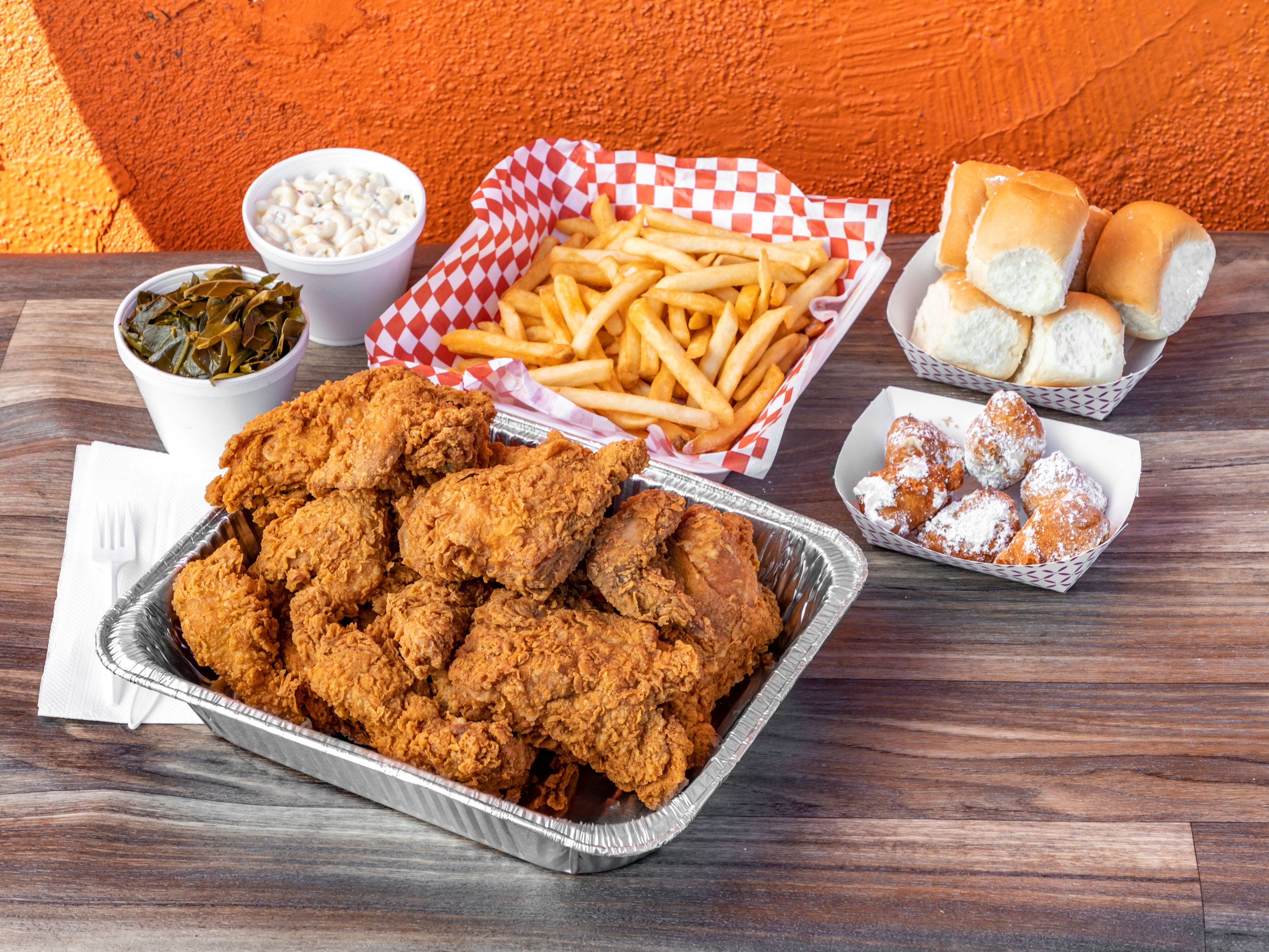 Order 16 Piece Chicken , 2 Large Sides, 4 Rolls food online from Charlie Famous Fried Chicken store, Los Angeles on bringmethat.com