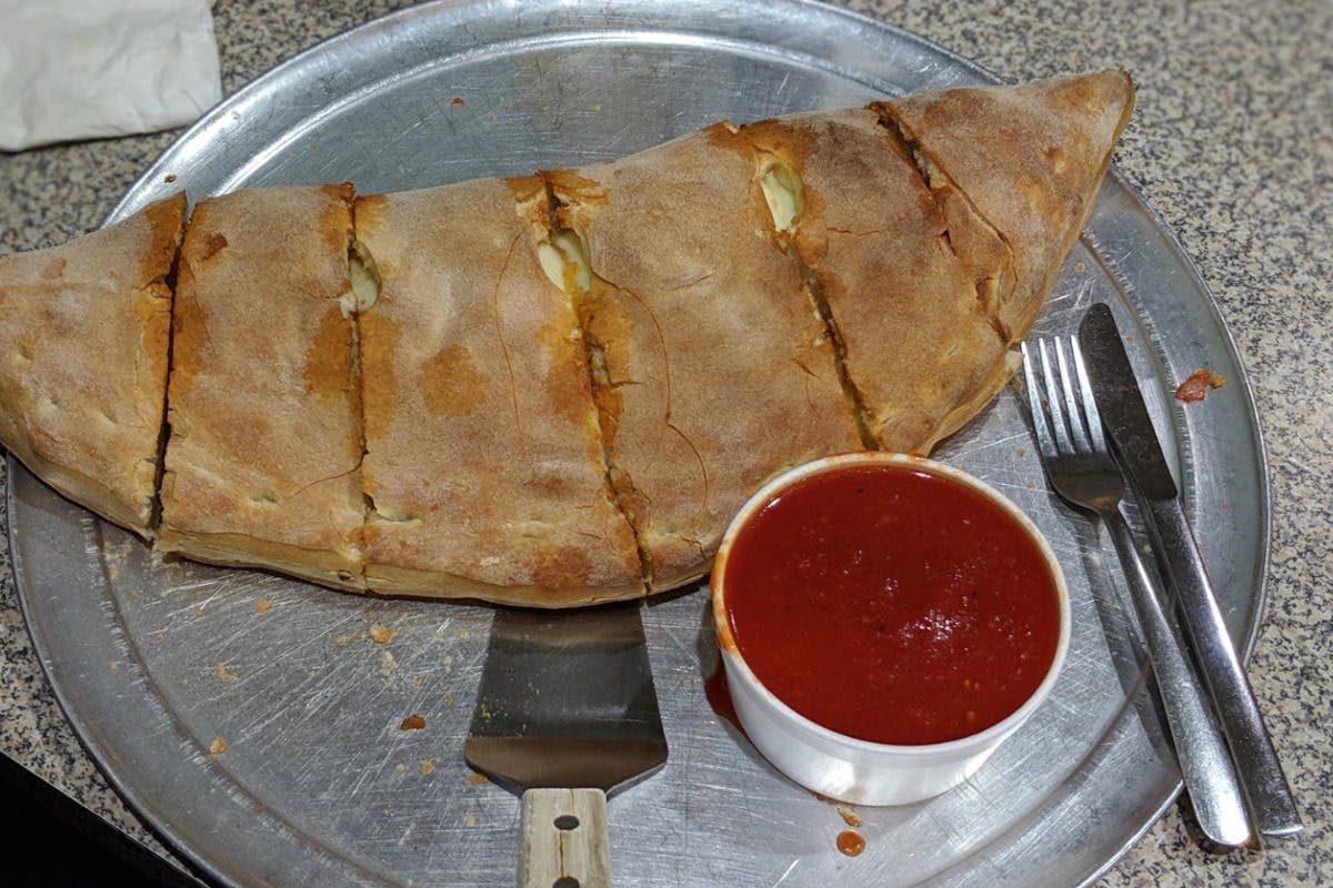 Order Calzone - Large food online from Italian Pizzeria store, Durham on bringmethat.com
