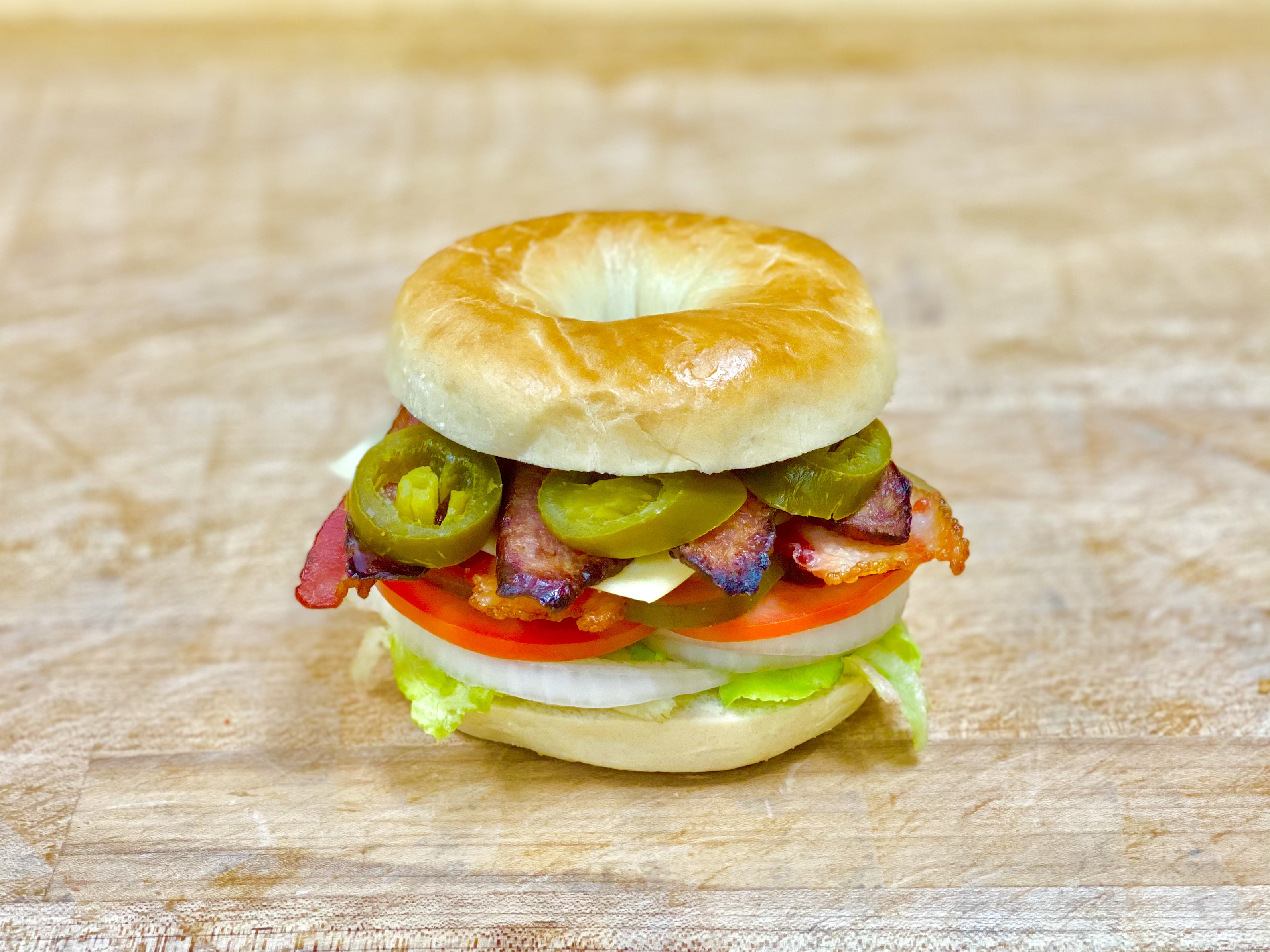 Order L-11 Bacon & Sausage & Cheese Bagel food online from K-Inn Donuts store, Paramount on bringmethat.com