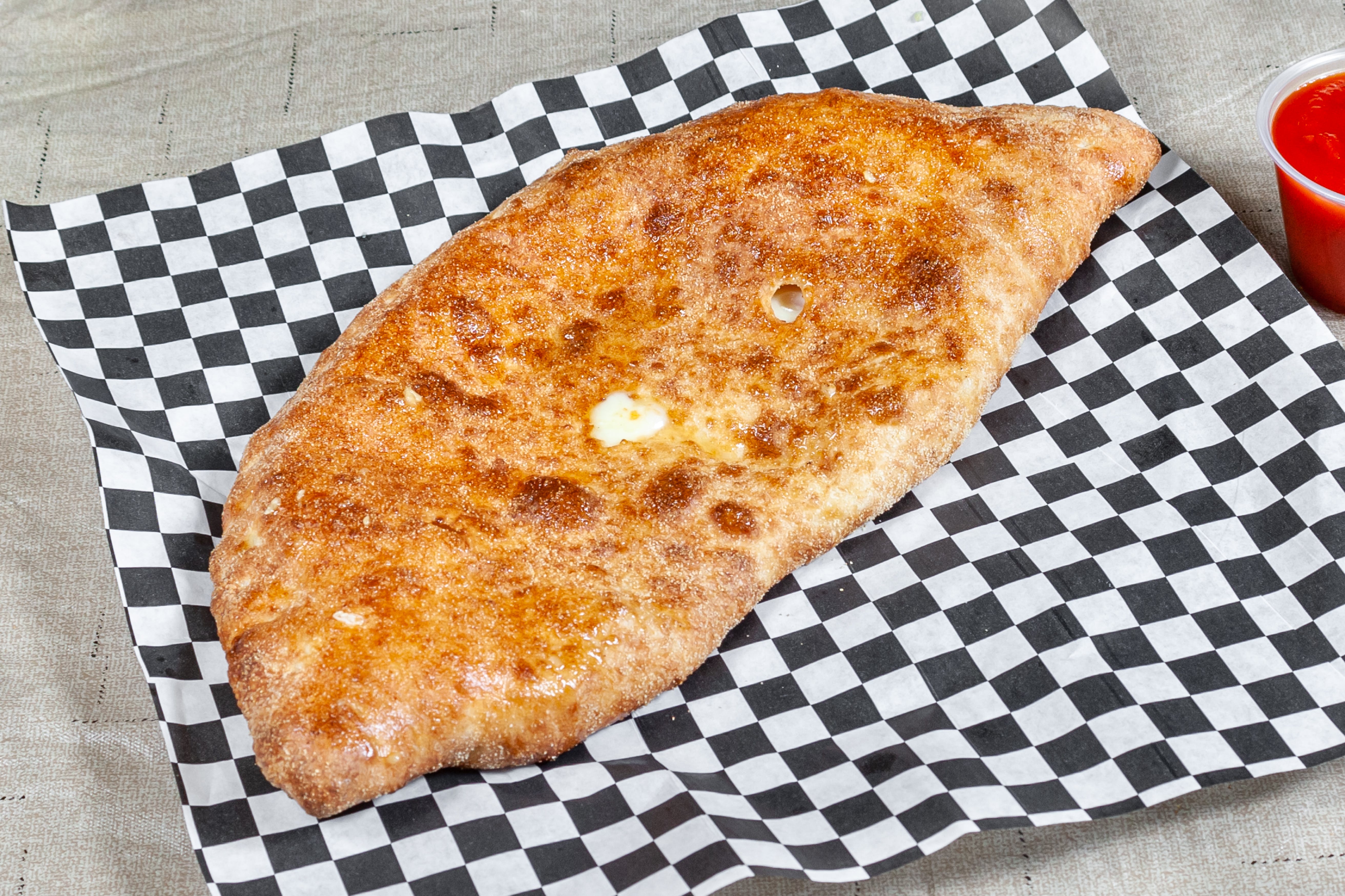 Order Calzone - Calzone food online from Geno D's Pizza store, Charlotte on bringmethat.com