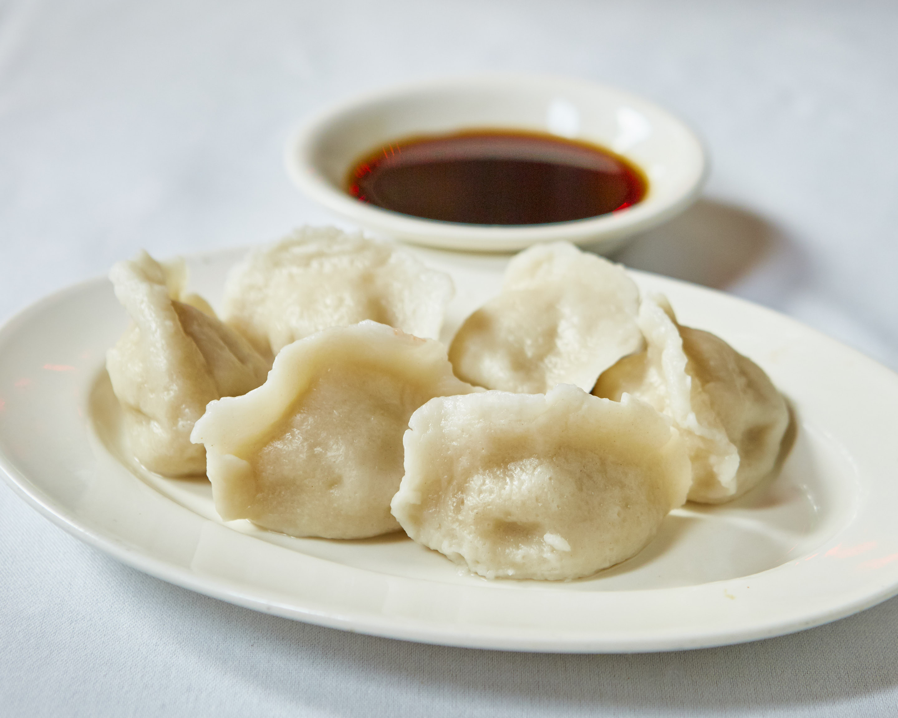 Order 27. Steamed Dumplings food online from Ollie's Sichuan store, New York on bringmethat.com