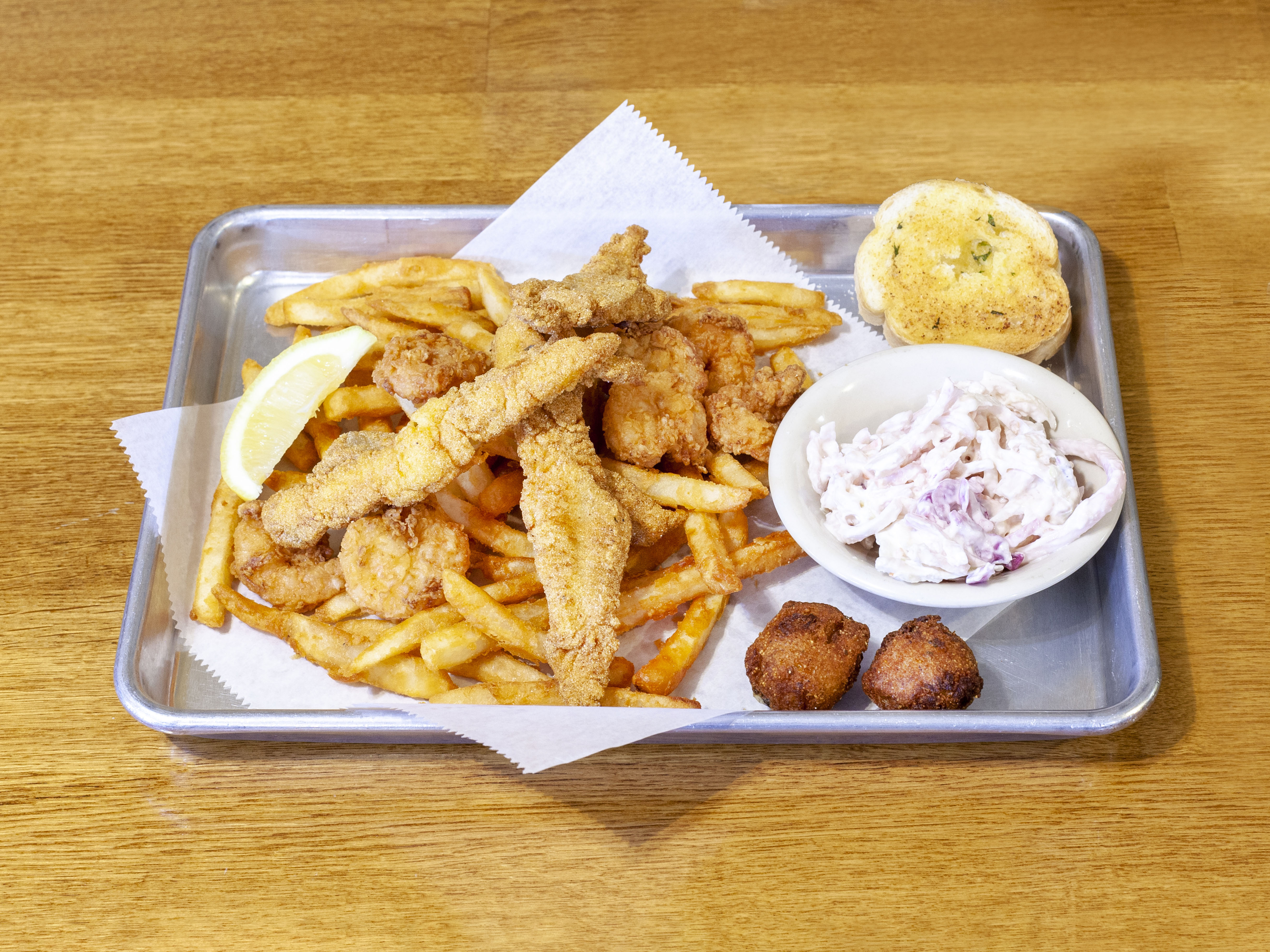 Order Seafood Basket food online from Taste of Louisiana (TOLA) Cafe store, Denham Springs on bringmethat.com