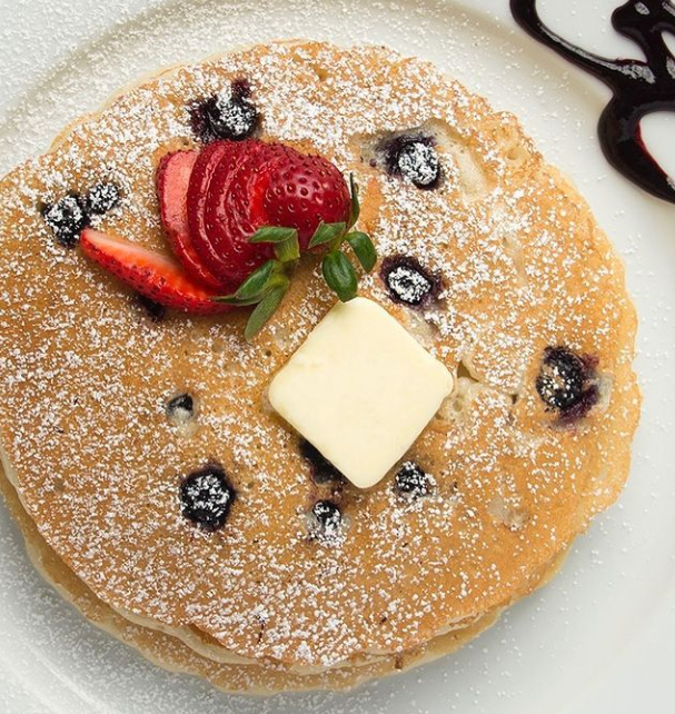 Order Wild Blueberry Pancakes food online from Naked Cafe store, Encinitas on bringmethat.com