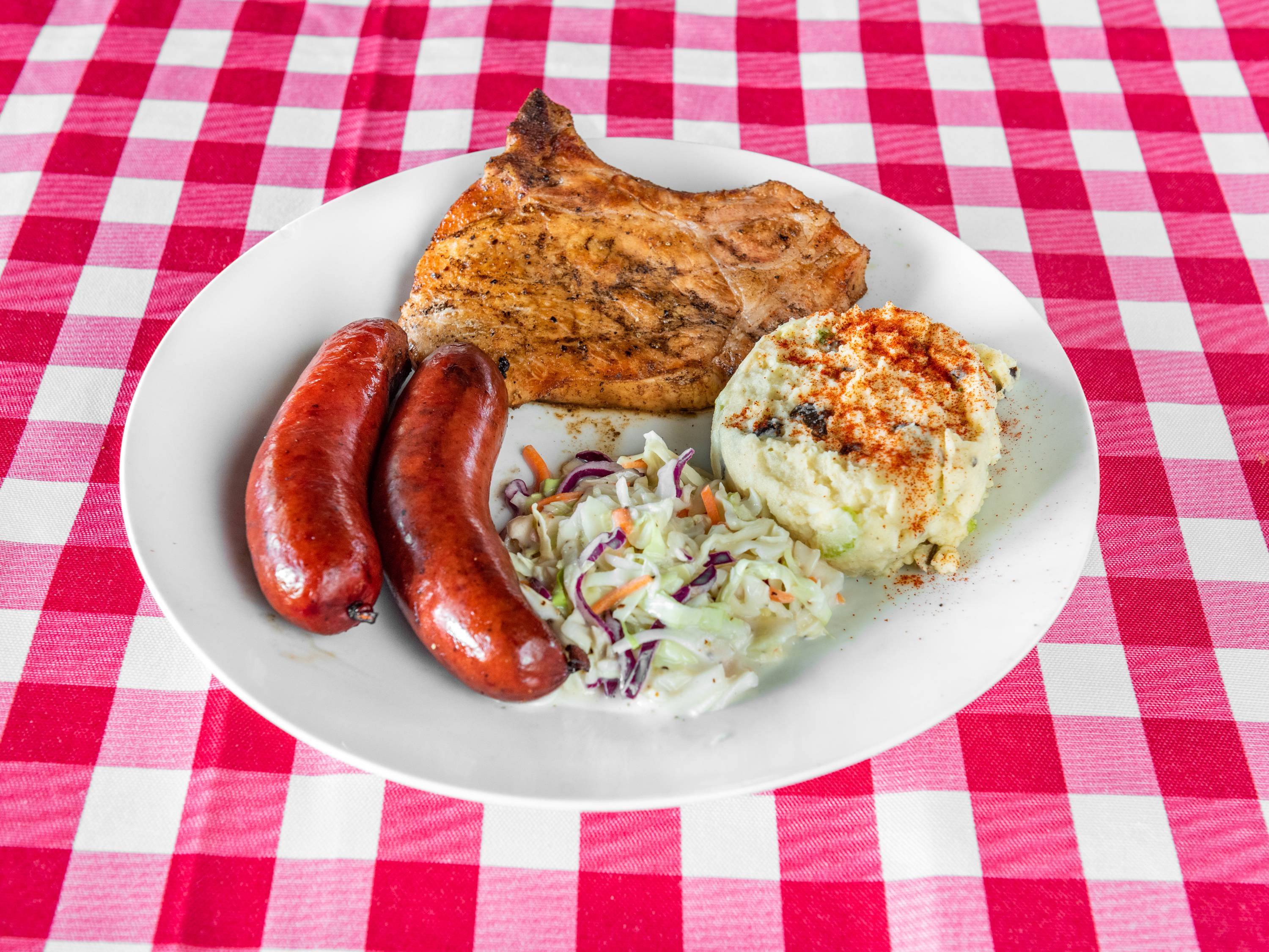 Order 2 Meat Plate w/2 sides food online from Shaws Country Kitchen store, Round Rock on bringmethat.com