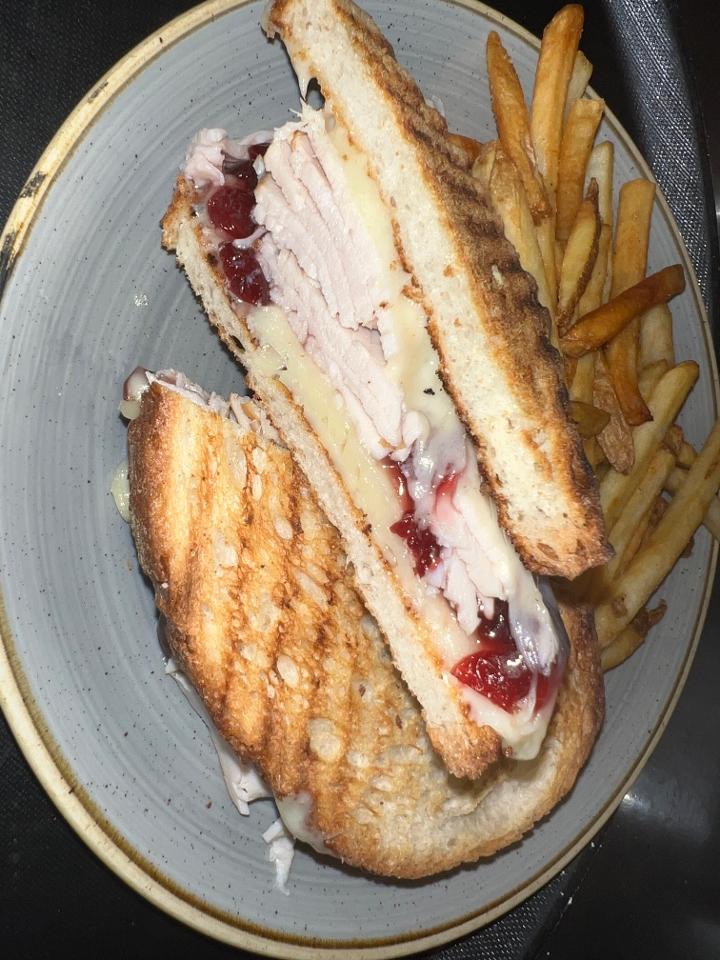 Order Turkey Cranberry Panini food online from The Coop store, Waukesha on bringmethat.com