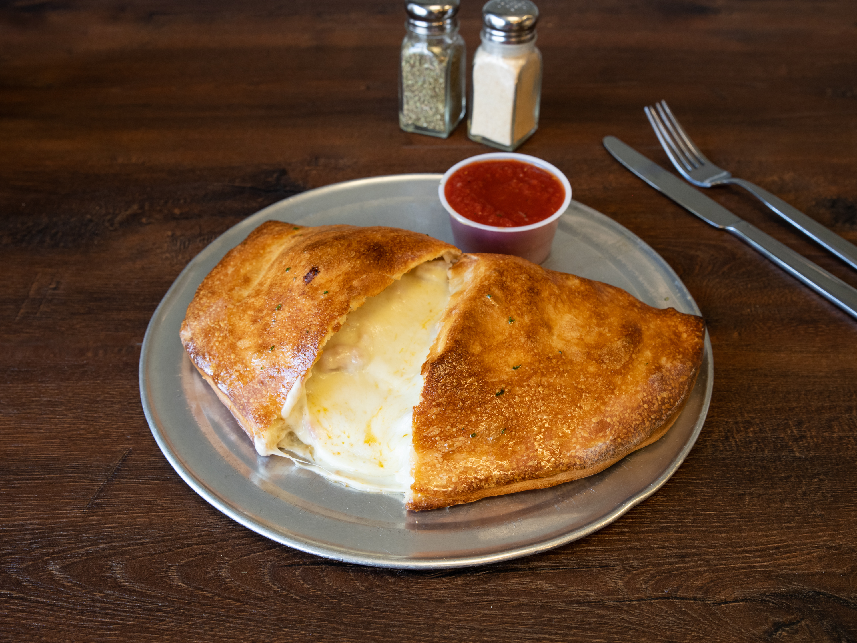 Order Cheese Calzone food online from Italian Village Pizza store, Orlando on bringmethat.com
