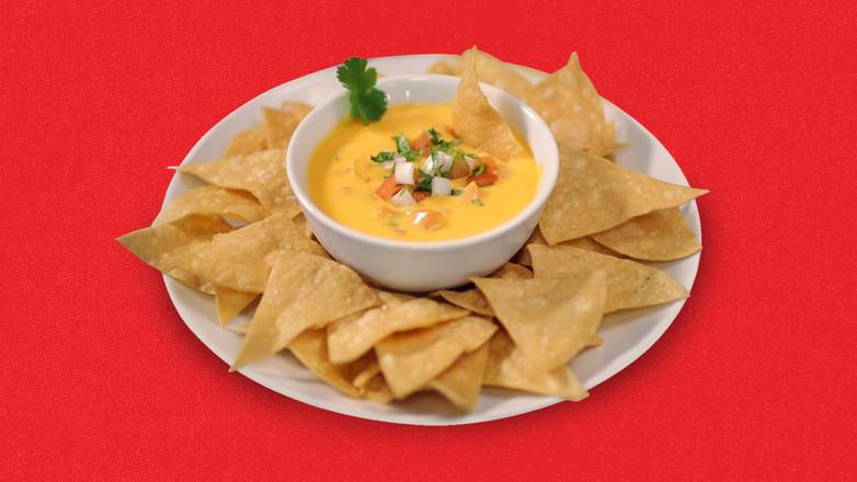 Order Chips & Queso 4oz food online from Taco Palenque store, Helotes on bringmethat.com