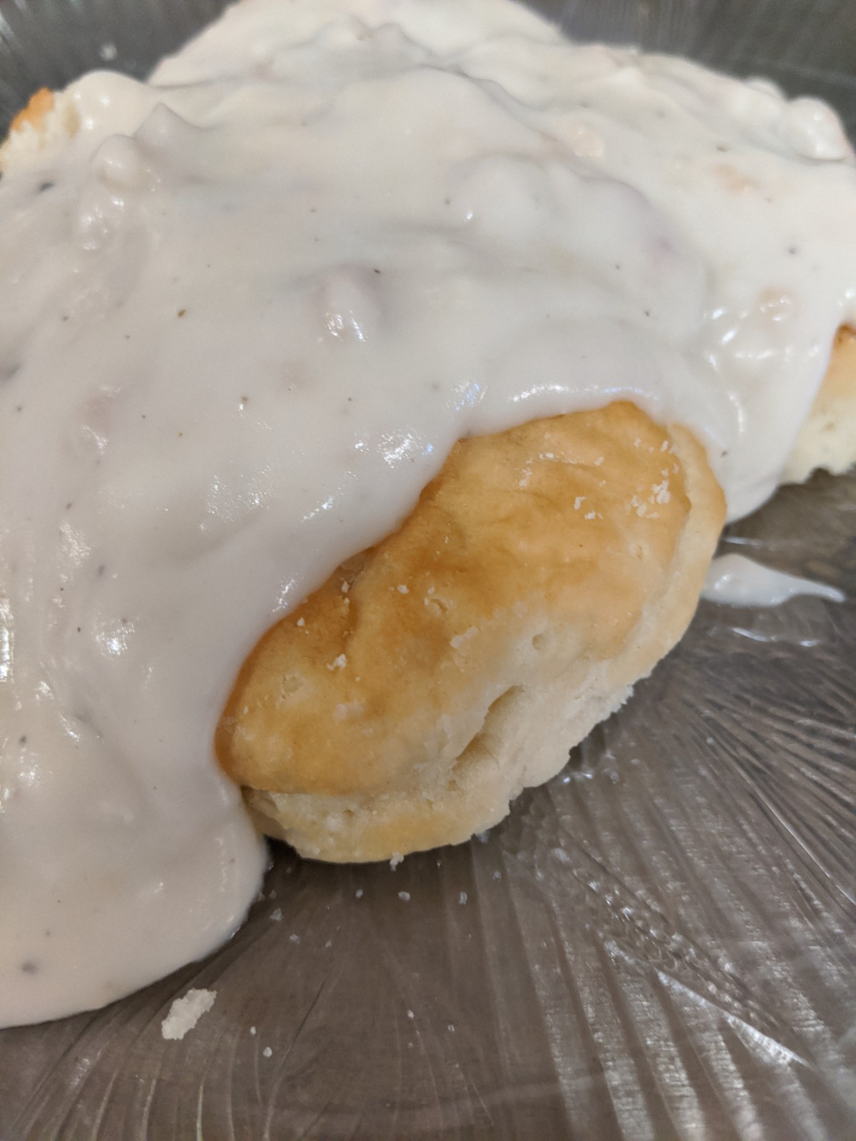 Order 2 Biscuits and Sausage Gravy food online from Us Egg store, Chandler on bringmethat.com