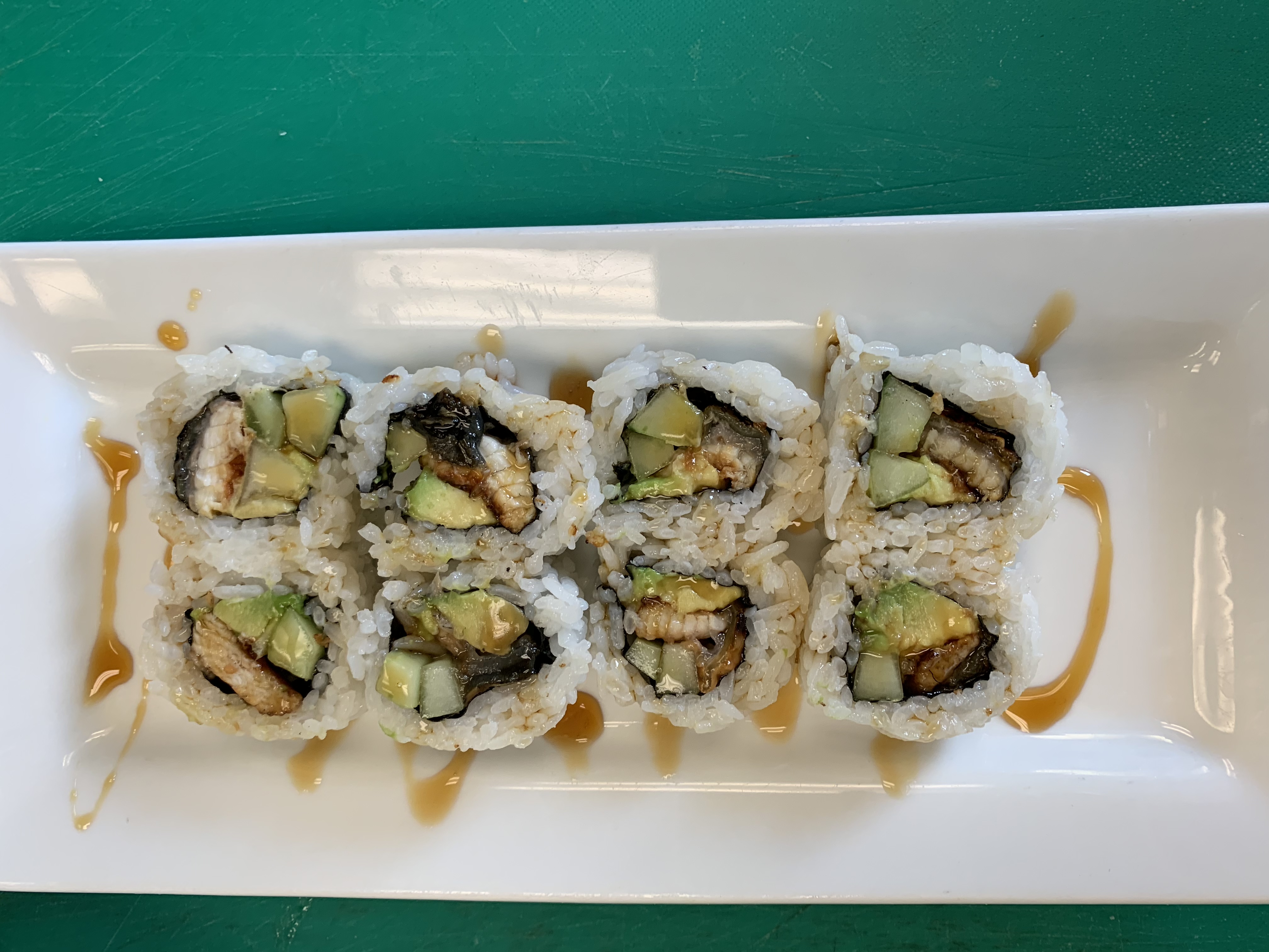 Order 10 Piece BBQ Eel Roll food online from Jazz Sushi Bar store, New Orleans on bringmethat.com