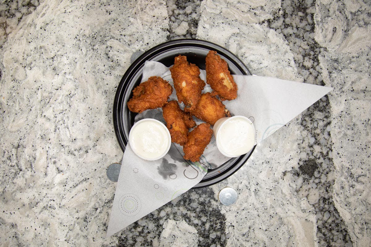 Order Traditional Wings - 6 Pieces food online from Topshelf Pizza & Pub store, Muskegon on bringmethat.com