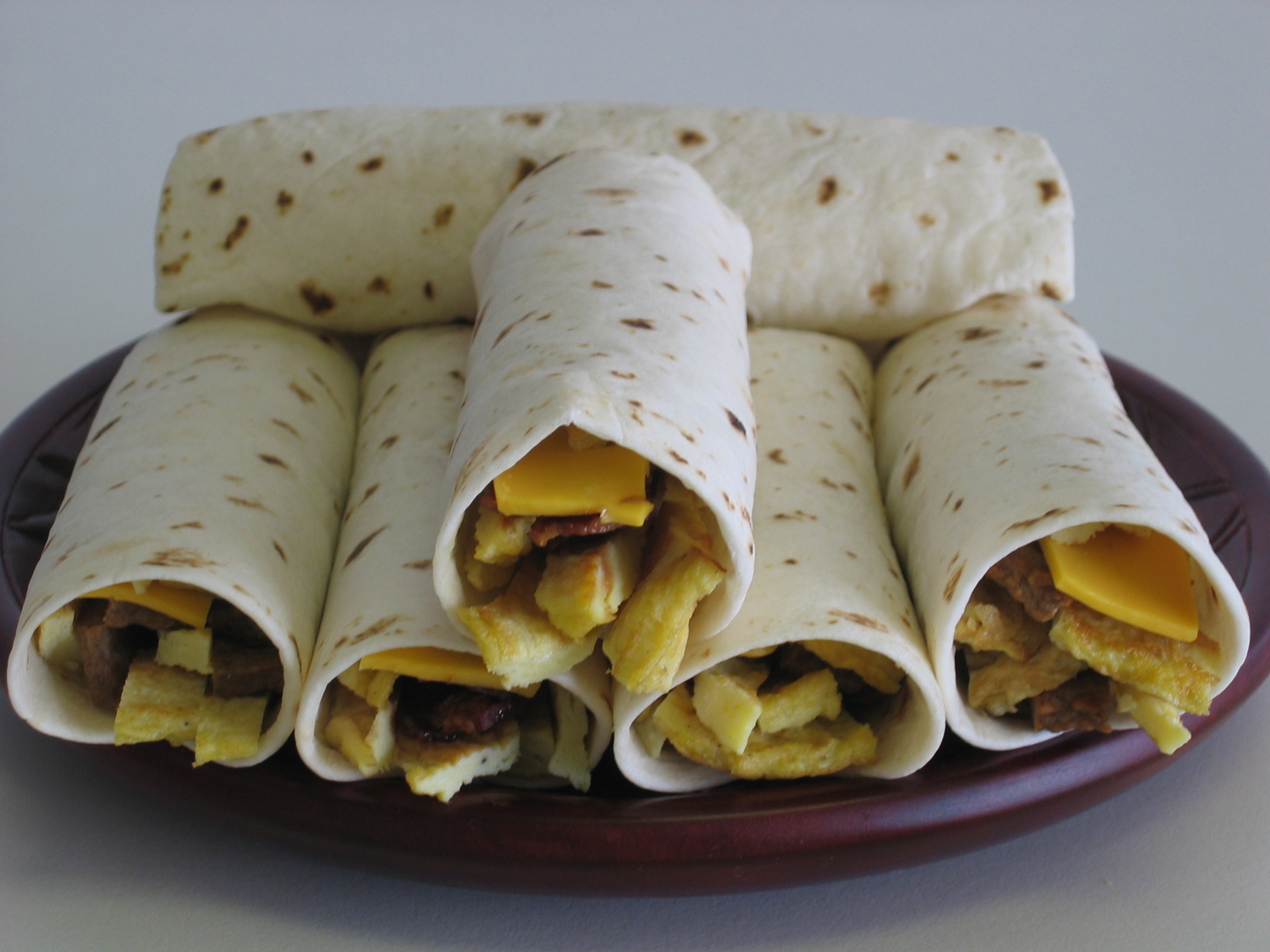 Order Sausage, Egg and Cheese Taco food online from Malenee Donuts store, La Porte on bringmethat.com