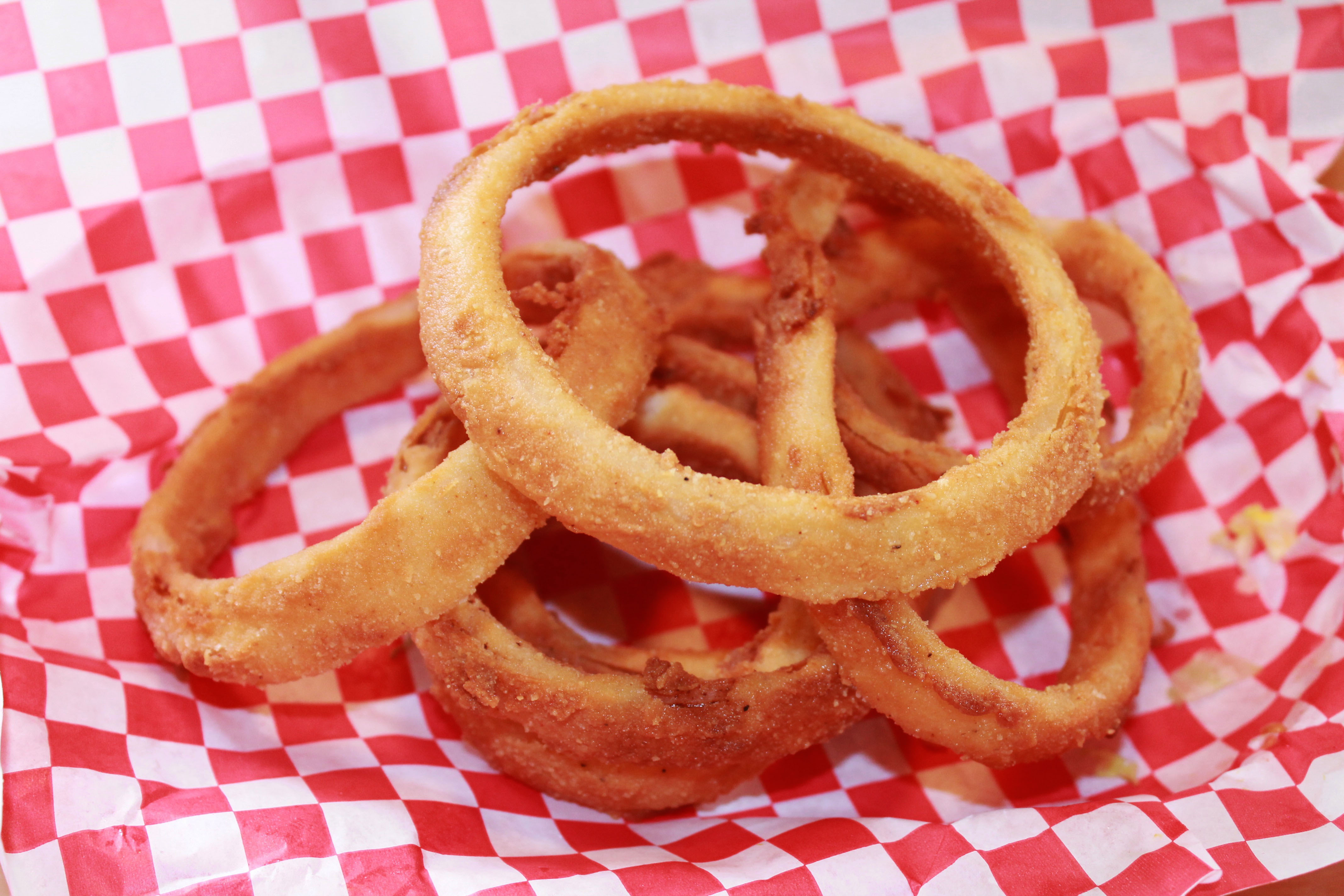 Order Homemade Onion Rings  food online from Pecan St. Station Deli And Grill store, Pflugerville on bringmethat.com