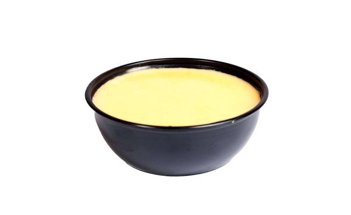 Order White Cheddar Cheese Sauce food online from Urban Bird Hot Chicken store, Houston on bringmethat.com