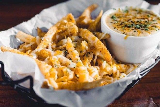 Order **Cheesy Cajun Fries food online from Chasin' Tails store, Arlington on bringmethat.com