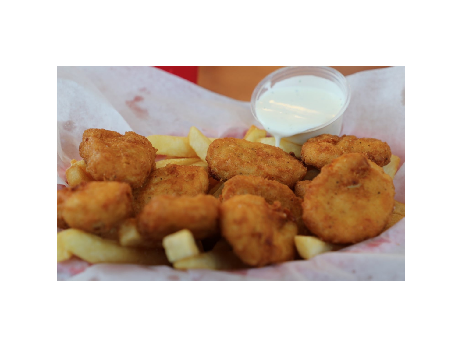 Order 10pc Chicken Nuggets food online from Norm Famous Burgers store, Whittier on bringmethat.com