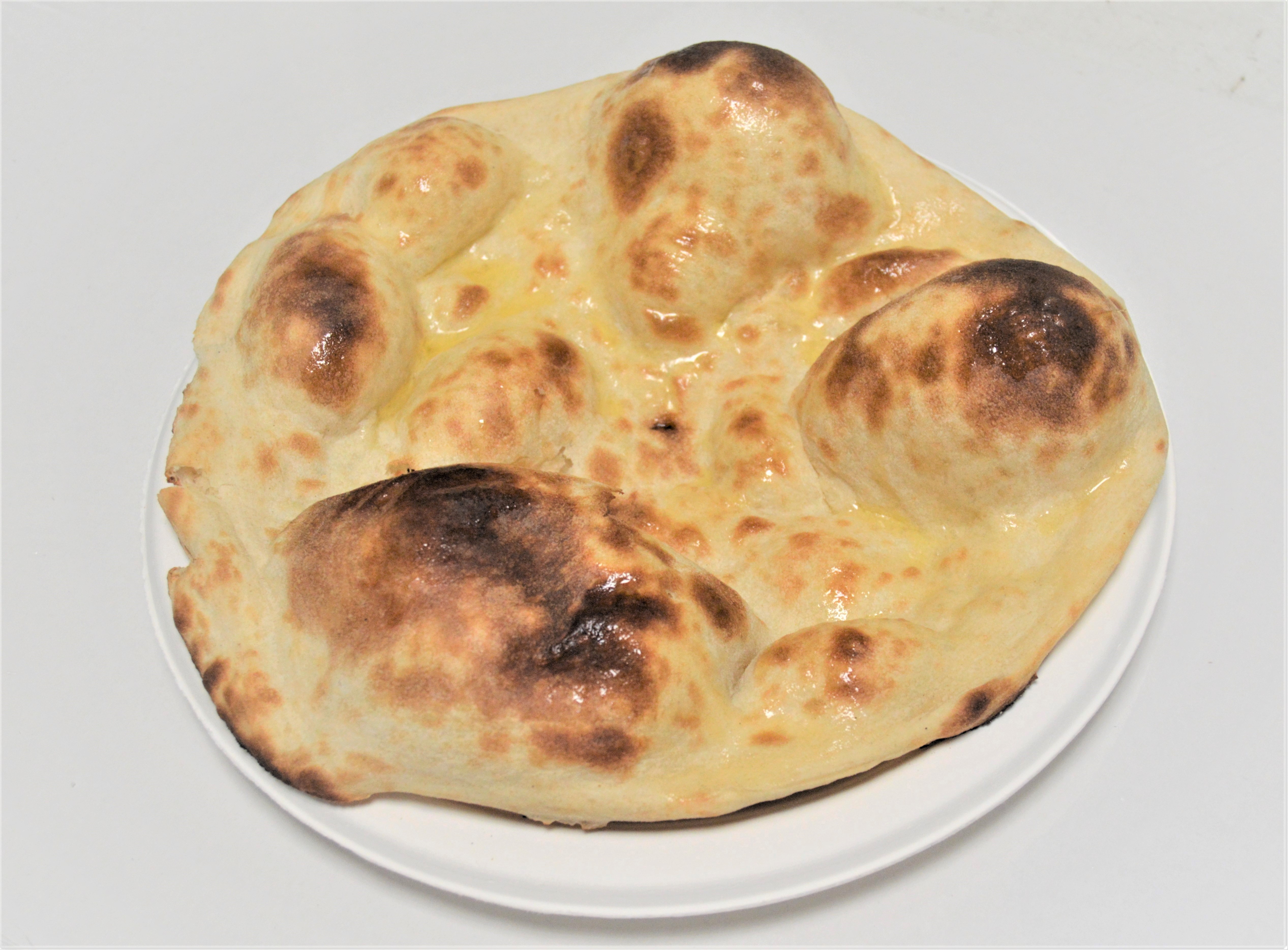 Order 16. Butter Naan food online from Salt And Pepper Grill Iii store, Washington on bringmethat.com