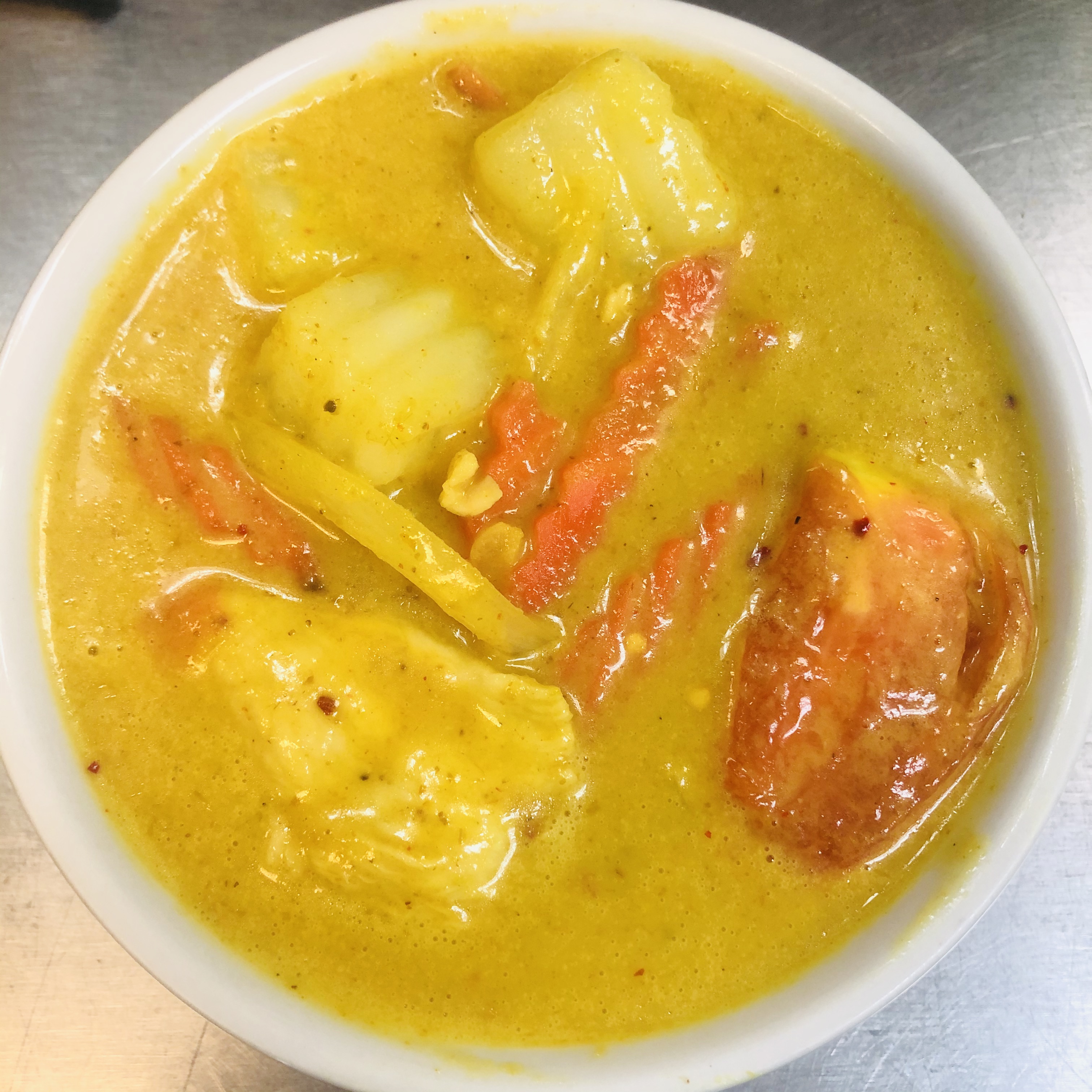 Order C5. Yellow Curry food online from Bangkok Orchid Thai Restaurant store, Irving on bringmethat.com