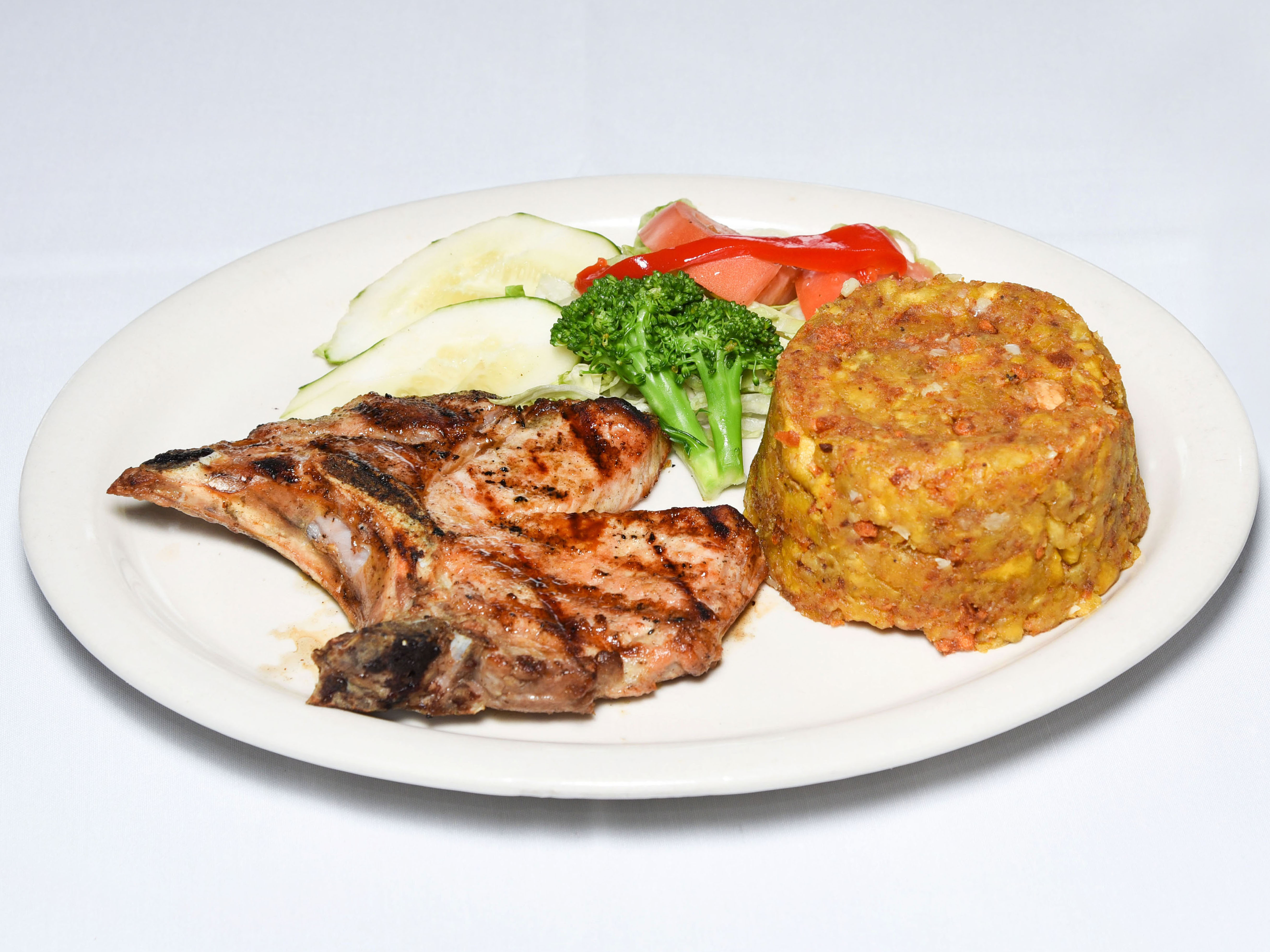 Order Broiled Pork Chops* food online from Caridad and Louie Restaurant Corp store, Bronx on bringmethat.com