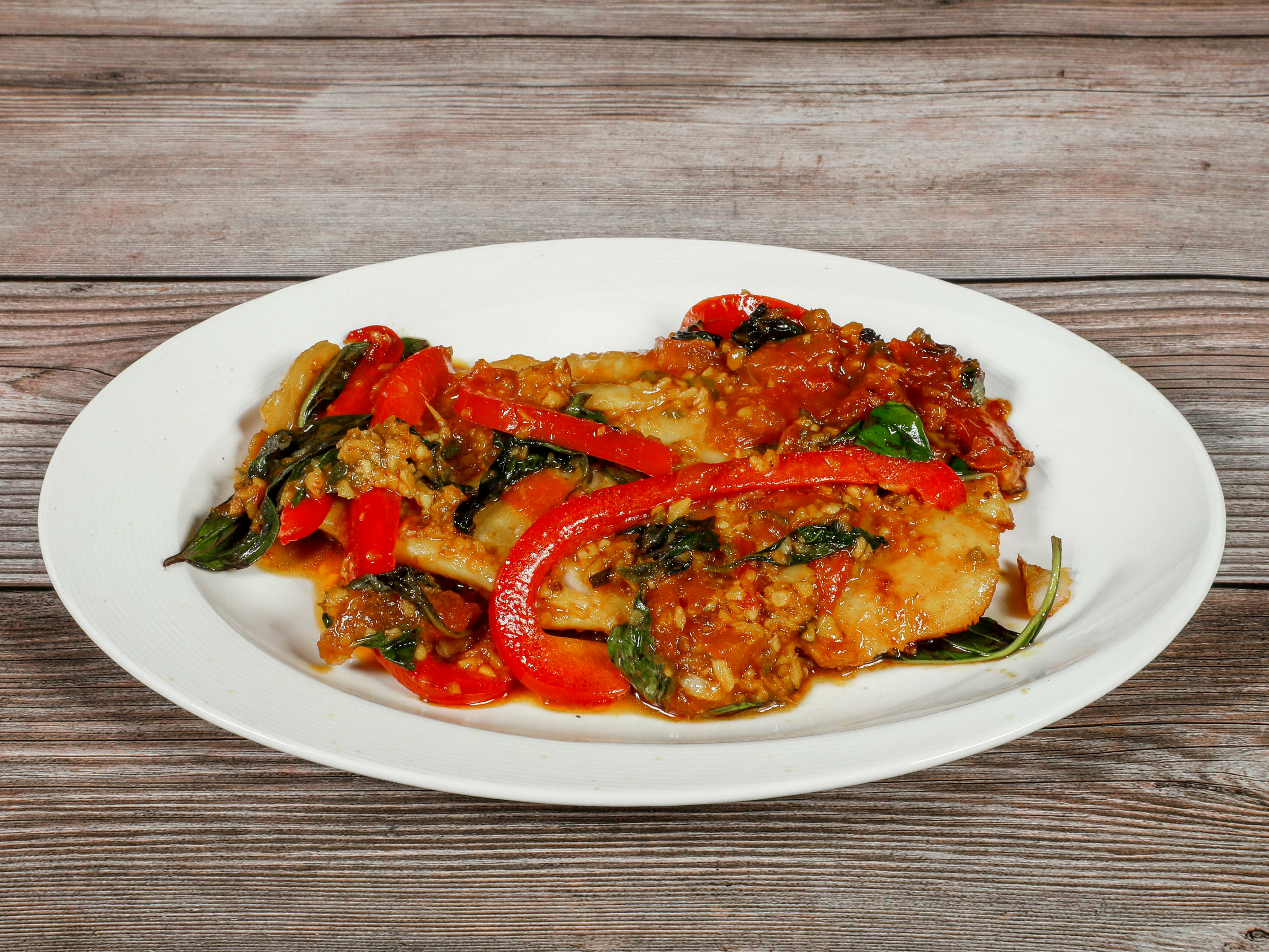 Order Basil Fish food online from Burmese Kitchen store, San Francisco on bringmethat.com
