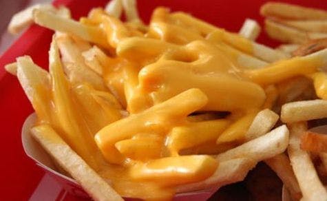 Order French Fries With Cheese - Side food online from Fox's Pizza Den store, Parkhill on bringmethat.com
