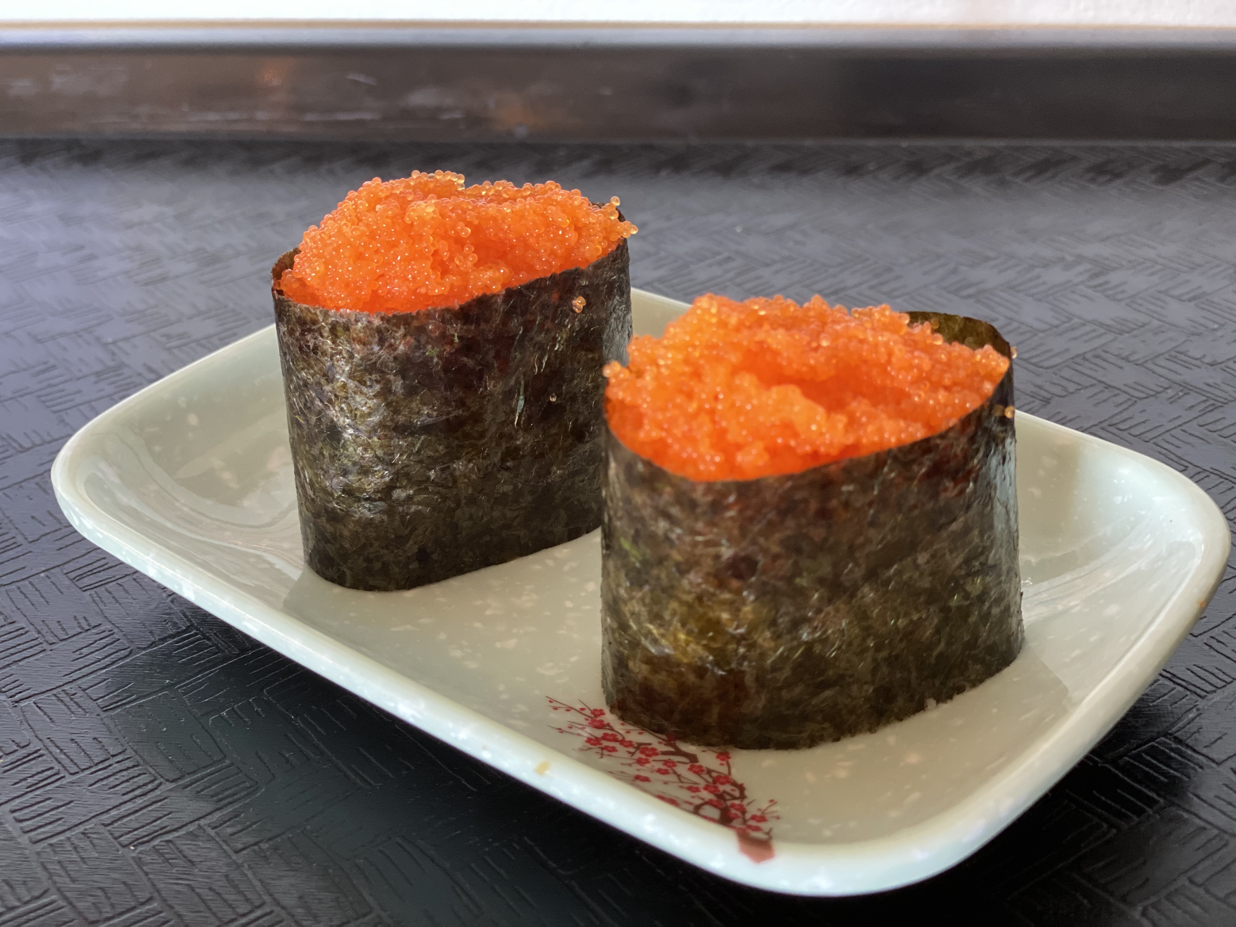 Order 58. Masago Nigiri 多春鱼籽贴面 food online from Tengu Sushi store, Newport on bringmethat.com