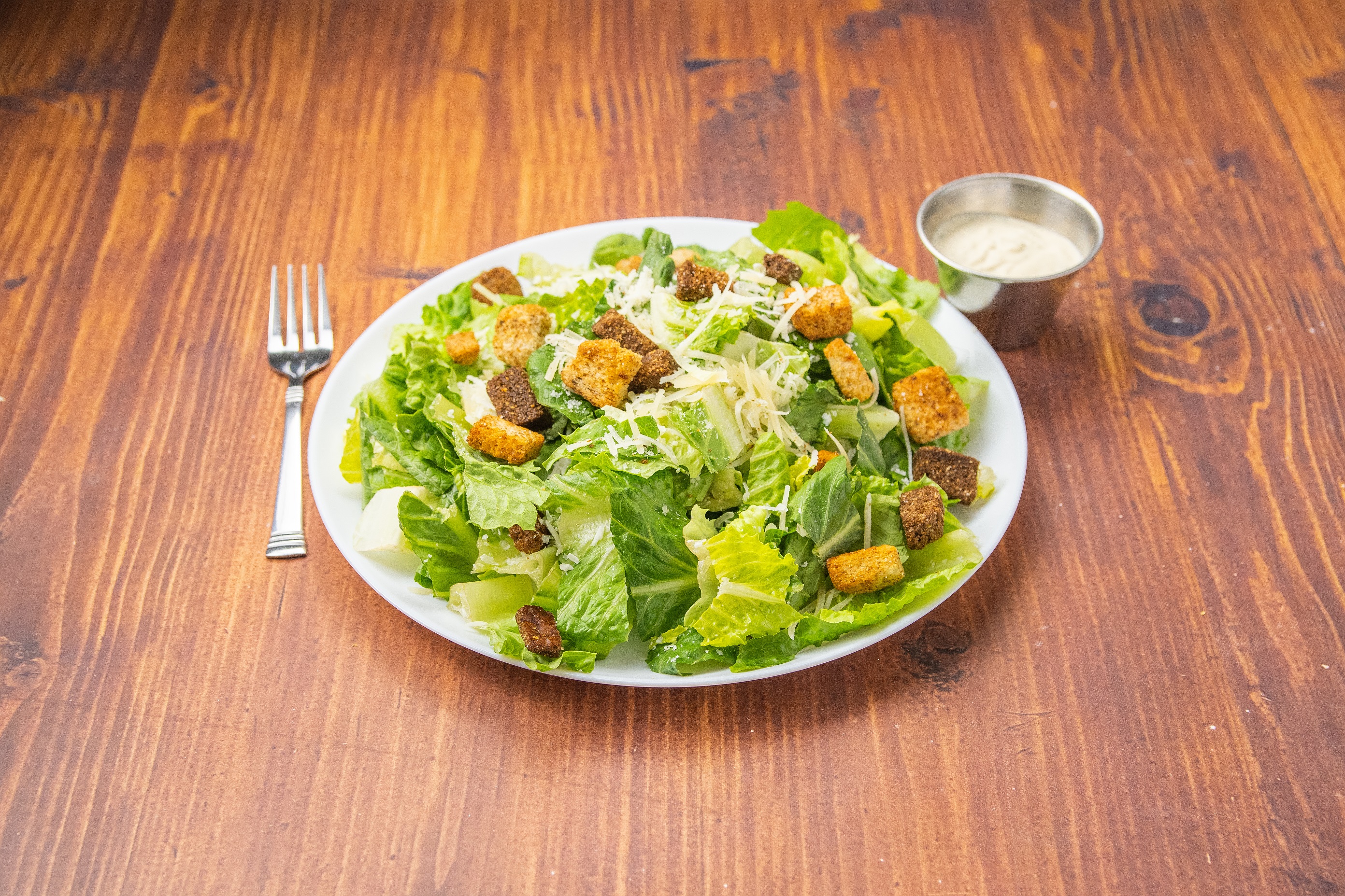 Order Garlic Caesar Salad food online from E Che Pizza store, Los Angeles on bringmethat.com