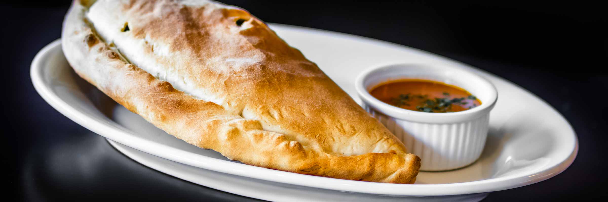 Order Spinach Calzone food online from Mangia Tutto store, Carson City on bringmethat.com